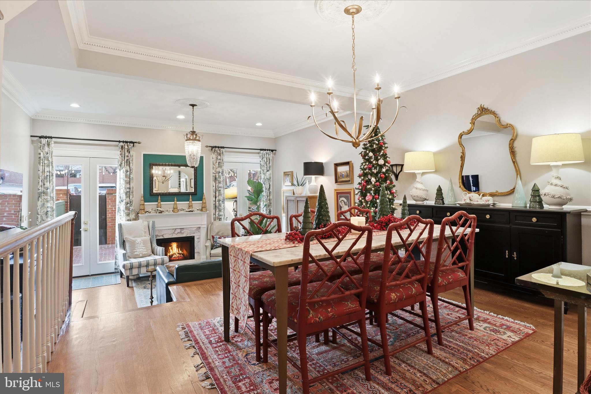 Elegance, Style, Grace...Everything you LOVE about Old Town Sophistication & MORE!  No detail has been overlooked to elevate this home to be the quintessential Old Town luxury residence. This stunning (2160 finished sq ft) three story townhome located in Bulfinch Square will surpass even the most discerning expectations. Like pages out of Southern Living magazine, every detail has been lovingly curated.  The impressive brick facade leads you into the welcoming foyer.  Architectural details including immaculate hardwood floors and crown moldings highlight this bright and open plan.  It's a chef's kiss for the kitchen!  Beautiful white cabinetry, built-in wine storage, and granite counters are just the beginning.  Chef it up for the holidays using the Bosch stainless steel appliances and host family and friends in the open living and dining spaces.  The cozy living room fireplace will keep you warm all winter long.  With French doors that lead to the gracious private brick patio, carry your large party entertaining outside with the charm of twinkle lights aglow.  Upstairs you will be sweet dreaming in the gorgeous primary suite.  Ample closets (including a private safe that conveys), crown moldings and a designer fan add special touches to make this room grand. The ensuite bath is the crown jewel of this expansive suite complete with a marble and cherry dual vanity, large glass enclosed shower, and room for a vanity / glam table.  The second bedroom with ensuite has views of the patio below.  Downstairs the lower level offers another gracious bedroom that can fit a king bed, and an ensuite bath touting a dual marble and cherry vanity and tub shower, designer lights and lovely ceramic tile.   You will never have to search for parking again in the city.  Two private parking spaces in the rear of the home as well as ample guest spaces provide all you will ever need.  A side alley also provides access to N Pitt Street from the parking area and is convenient for house servicing to the rear entrance.

When Santa comes to deliver his gifts here, he simply will not want to leave this home!  Come see why this is the epitome of the Old Town Alexandria lifestyle.