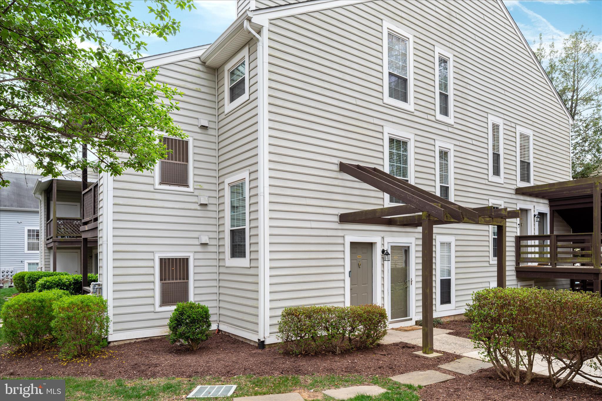 Highly desirable Oakton location offering exceptional commuter convenience- just minutes away from Vienna Metro, and 6 Miles only from Rolling Road VRE stations, with quick access to I-66 route 123 and route 50 for easy travel throughout Northern Virginia and Washington DC. Convenient access to shopping, dining, and major employment centers while enjoying a quiet residential setting.

This beautifully maintained 2-bedroom, 2-bath home features an open-concept layout filled with natural light. The main level offers a bright and airy living space with a cozy wood-burning fireplace, a nice dining area, and a galley-style kitchen with a pass-through to a counter-height bar — perfect for entertaining. The vaulted ceiling in the family room enhances the open feel, leading to an oversized balcony ideal for relaxing with your morning coffee or unwinding in the evening.

Exterior and interior security cameras in use. owner works from home: for privacy purposes only.

Down the hall, you’ll find a generously sized laundry room, a full bath, and a secondary bedroom with peaceful wooded views. A versatile landing area on the way to the upper level provides the perfect space for a home office, craft, or hobby station.

Upstairs, enjoy a spacious loft-style primary suite offering privacy and comfort, complete with a walk-in closet and a full en-suite bath.

The condo includes the outdoor swimming pool, two parking spaces, ample guest parking, and access to wonderful community amenities. Schedule your tour today!