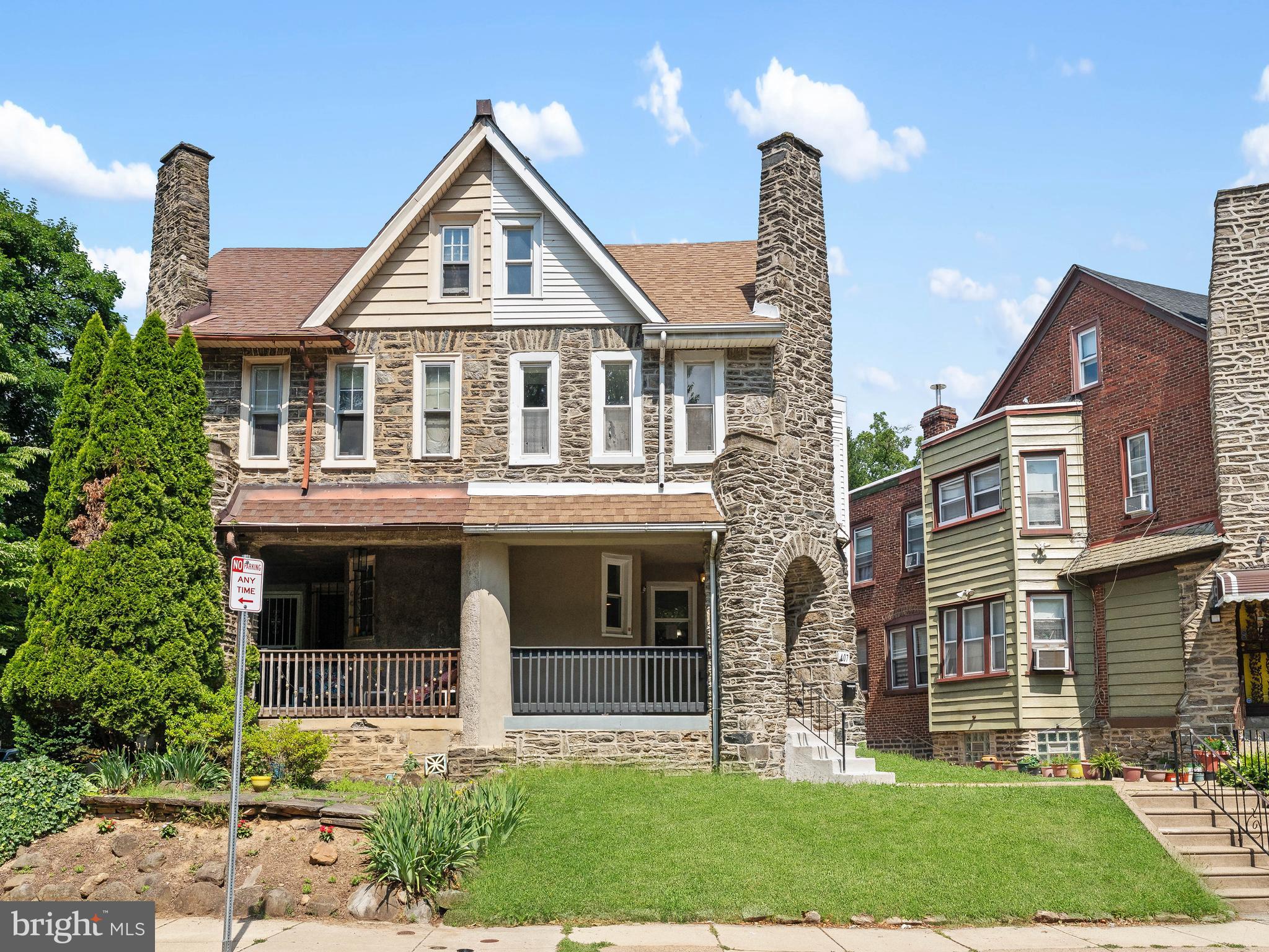 Directly across the street from Fernhill Park - 407 W Abbottsford Ave is spacious 4-bedroom, 2.5-bath Germantown twin with over 1,800 sq ft of living space across three levels. A bright, airy layout welcomes you with wide-plank style flooring, recessed lighting and sun-filled front and middle living areas framed by large windows. The main level flows naturally from a defined living space into an eat-in kitchen and dining area featuring warm cabinetry, modern lighting and an open layout ideal for both everyday living and entertaining. Upstairs, you'll find a total of 4 well-sized bedrooms, including a primary suite with a private full bath. The layout offers flexibility for guests, a home office, or growing households. The lower level adds more functionality with a  full basement and direct garage access, providing valuable storage and utility space. Additional highlights include central air conditioning and electric heating for year-round comfort. Outdoor features include a welcoming front porch, private rear deck just off the kitchen, one-car attached garage and additional off-street parking. Easy access to local shops, public transportation and major roadways, this home offers a combination of space, structure and opportunity in a well-established Philadelphia neighborhood.