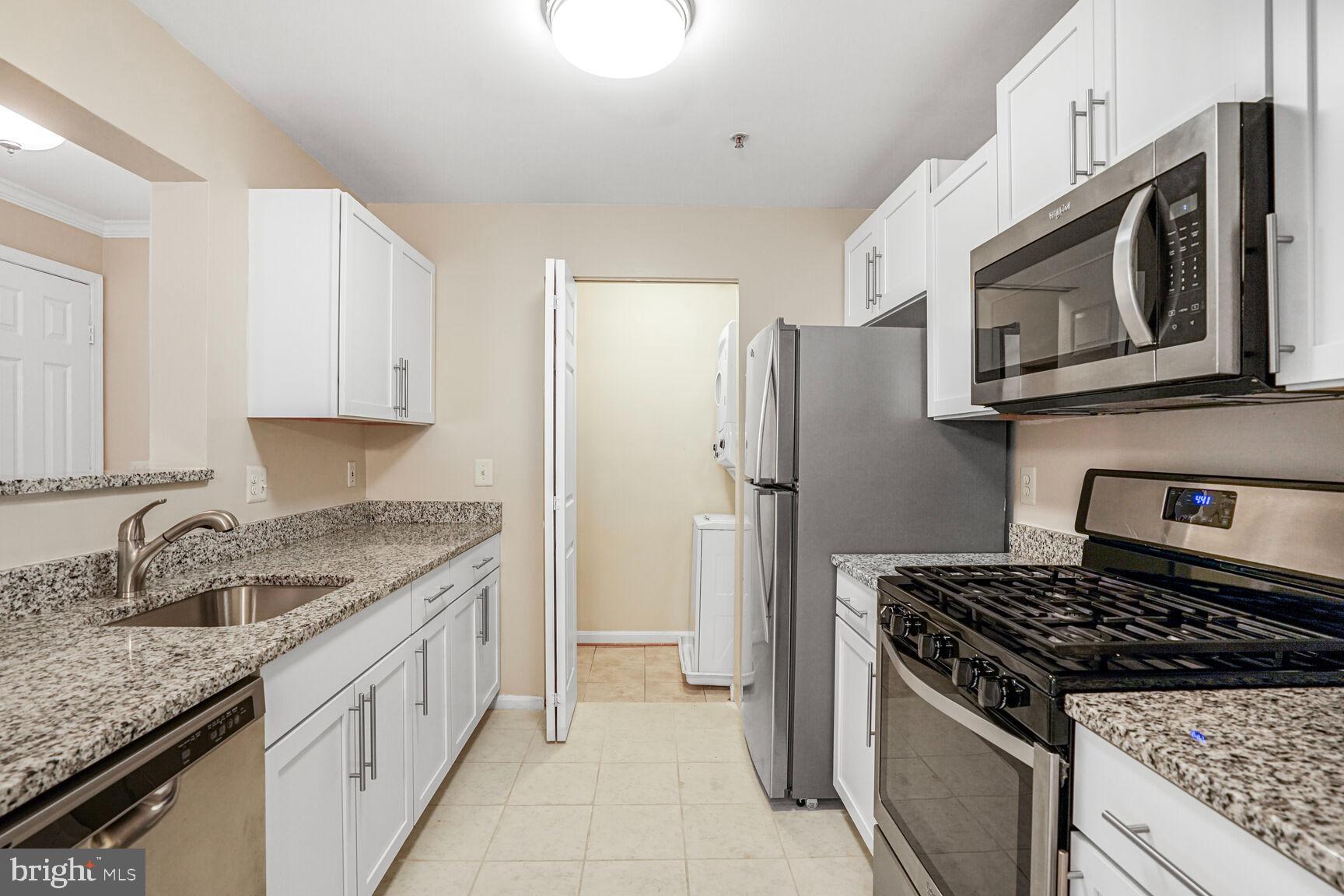 Now presenting this fully renovated Second Floor, 2 Bedroom / 2 Bathroom Condo with Extra Den, located in a private location in the Prospect Cove at Lakeside neighborhood. Nestled in the corner of the neighborhood, surrounded by trees and the nearby pond, this freshly painted and carpeted unit boasts a bright and open floorplan flooded with natural light throughout the entire condo! Well-designed layout offers renovated kitchen with white cabinets, granite counters, stainless appliances, pantry and access to extra storage closet that contains in-unit washer/dryer.  The kitchen also includes an open concept breakfast bar that overlooks large family room with fireplace, ceiling fan and glass door that exits to large and private exterior patio, perfect for your morning coffee or outdoor entertainment.  Condo boasts two large bedrooms on either ends of the layout, providing an ideal floorplan for applicants looking.  Primary bedroom with walk-in closet, ceiling fan and attached primary bathroom with tub and shower combo. Second large bedroom has closet and access to hallway full bathroom also with tub and shower combo.  Den space provides additional interior living area that can be set up as a reading room or office. Condo is conveniently located next to community amenities like the pool, playground, tennis courts, basketball courts and clubhouse. Centrally located near schools, gyms and multiple shopping centers that include grocery stores, coffee, retail and dining options, including a five minute drive to Potomac Mills and Wegmans.   Nearby Route 1, 95 and the VRE for commuting purposes. Pets allowed on case by case basis. Come by and see us today, the condo is available now!