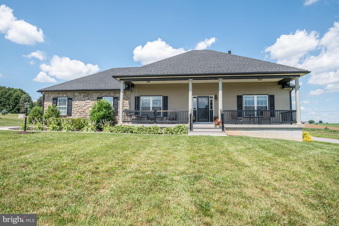 Better than new 3 bedroom 2 bathroom rancher in Solanco School District.  Located on a corner lot in a friendly cul-de-sac neighborhood , this home is only three years old!  Spend your days relaxing on the oversized front porch swinging on the porch swing as you take in the beautiful Lancaster County countryside.  Farmland views for miles!  Inside, you'll find upgrades galore!  The family room boasts a gas fireplace and beautiful concrete mantel.  The kitchen is straight out of a magazine and includes textured granite countertops, under cabinet lighting, and elegant light fixtures.  Soak up the sun in the enclosed Florida room, which is separated from the main living room by a sliding barn door.  The spacious master bedroom includes a large walk-in closet, and the master bathroom boasts a doubl!e vanity with granite countertops and a brand new walk-in shower.  This is one home you definitely need to see!