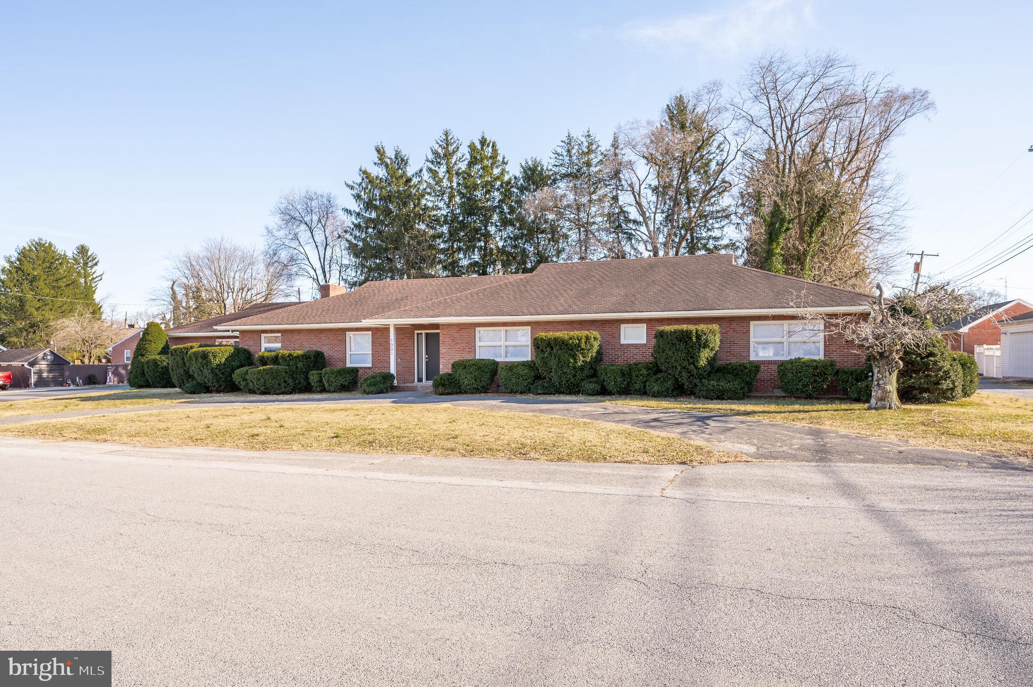 Welcome to 1001 North St located in the well known community of Star Acres in the heart of Martinsburg. This expansive rancher was well maintained and loved for many years. Now, fully renovated and modernized, it is ready to show off and find new owners. Key features include a new HVAC system, two primary suites on the main floor, two additional bedrooms and full bath on main level,  beautiful kitchen with stainless steel appliances and quartz countertops, additional refrigerator,  two family rooms, and so much more. The basement has been finished to provide additional living space and a fifth bedroom. There is plenty of parking with a two car garage, large driveway, and additional circular driveway in the front of the home.  Sitting on a corner lot, this home is located close to schools, shopping, dining, the hospital, and commuter routes.