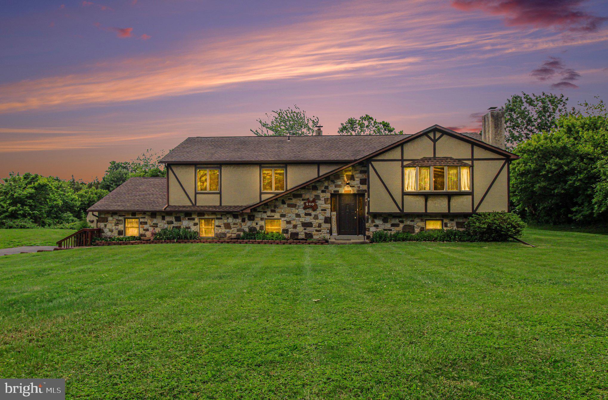 Nestled on nearly 2 private acres in the desirable Souderton Area School District, this charming Tudor-style home offers space, comfort, and incredible potential. The serene setting features an expansive backyard with a deck and fire pit, perfect for relaxing or entertaining.

With nearly 2,800 square feet of finished living space, the home offers 5 bedrooms and 3 full bathrooms across two distinct levels. The upper level includes the primary suite, two additional bedrooms, a spacious great room with exposed beams and a wood-burning fireplace, plus the kitchen, dining area, and breakfast nook. The lower level features two more bedrooms, a full bath, and a large flexible living space with direct, step-free access from the attached garage.

Additional highlights include two attic storage areas, public sewer, well water with a water softener, and a 1-year home warranty. While the home offers an opportunity for cosmetic updates, it is surrounded by million-dollar properties, making it an excellent value and investment opportunity.

A pre-listing home inspection has been completed and is available upon request. Come experience the privacy, space, and potential this unique property has to offer.