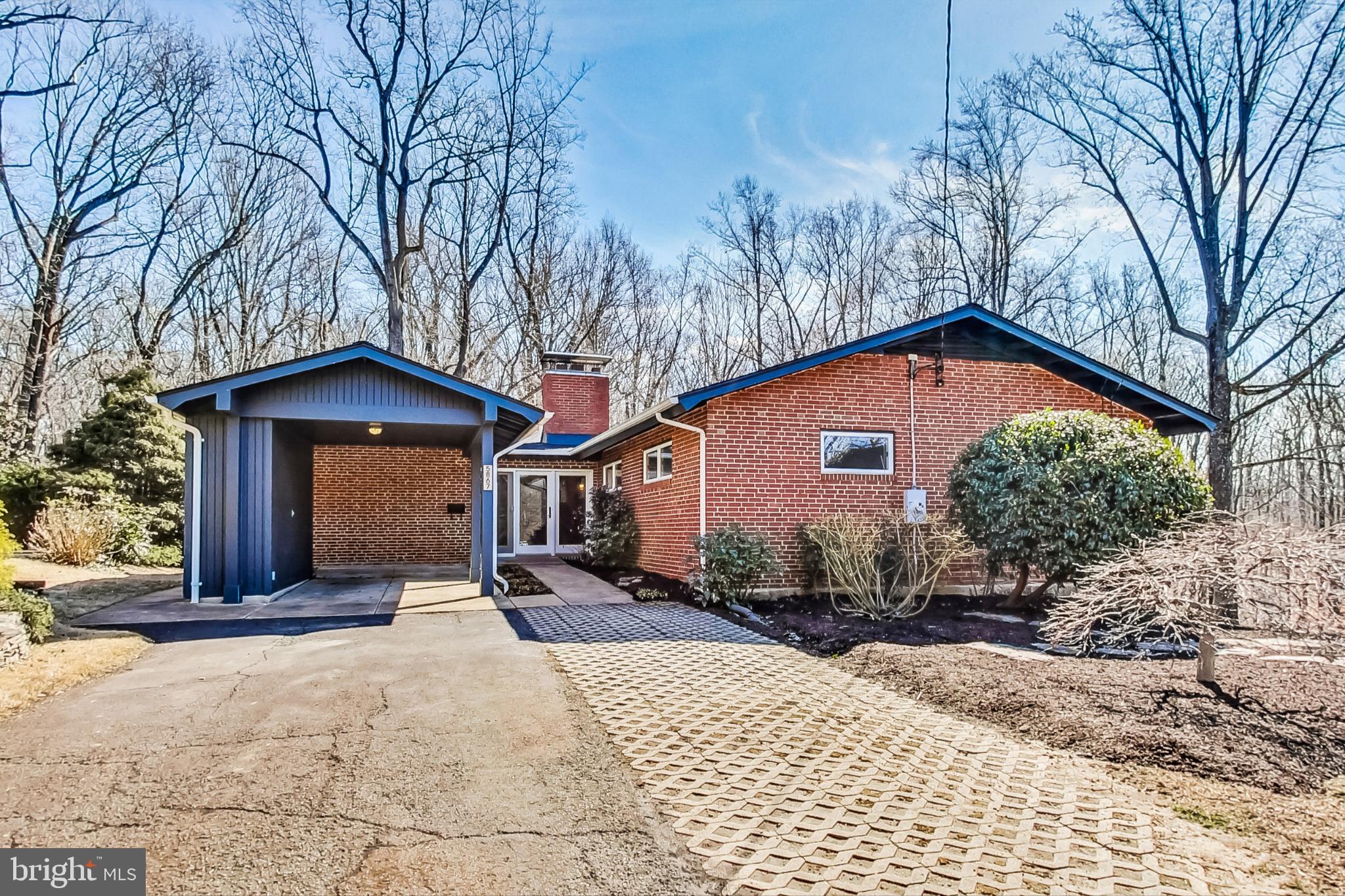 Welcome to this breathtaking two-level home offering 5 spacious bedrooms, 3 full bathrooms, and 3,471 square feet of meticulously finished living space. 

The open-concept living area boasts a stunning wood burning fireplace, soaring cathedral ceilings, and expansive floor-to-ceiling windows that fill the upper level with natural light and provide spectacular views of the surrounding trees. The updated kitchen is a chef’s dream with ample cabinetry, sleek stainless-steel appliances, and a convenient peninsula that doubles as a breakfast bar. A cozy built-in nook near the entrance offers the perfect space for a sitting area or study. The luxurious master suite is a true retreat with panoramic views, beamed, cathedral ceiling, a lavish custom master bath featuring a gorgeous tile shower and dual vanities, plus two walk-in closets. Two more bedrooms and a full hall bathroom complete this level. 

The fully finished walkout basement is an entertainer's paradise, complete with a second wood burning fireplace, a large family room, a full bathroom, and two additional bedrooms, one of which opens directly to a covered patio, ideal for outdoor enjoyment. Home is equipped with two water heaters. 

Tucked away on a private third-acre corner lot in Dowden Terrace, this property offers an unparalleled living experience. Backing onto the peaceful Dora Kelley Nature Park and the Holmes Run Trail, you'll enjoy the best of both city life and nature. Imagine stepping outside to find yourself surrounded by lush trails and a 50-acre nature preserve, all while being in the heart of the city. Nestled in a vibrant neighborhood, this home offers a wealth of amenities, including scenic walking and biking trails, a playground, and a community pool. 

With easy access to I-395, nearby Dash and Metro bus stops, and just under 10 miles to both downtown DC and Reagan National Airport, this location is second to none. Only 6 miles from historic Old Town Alexandria, you'll enjoy the convenience of shopping, dining, and much more just around the corner. This unique home is sure to captivate you from the moment you step inside, offering an undeniable sense of comfort and belonging.