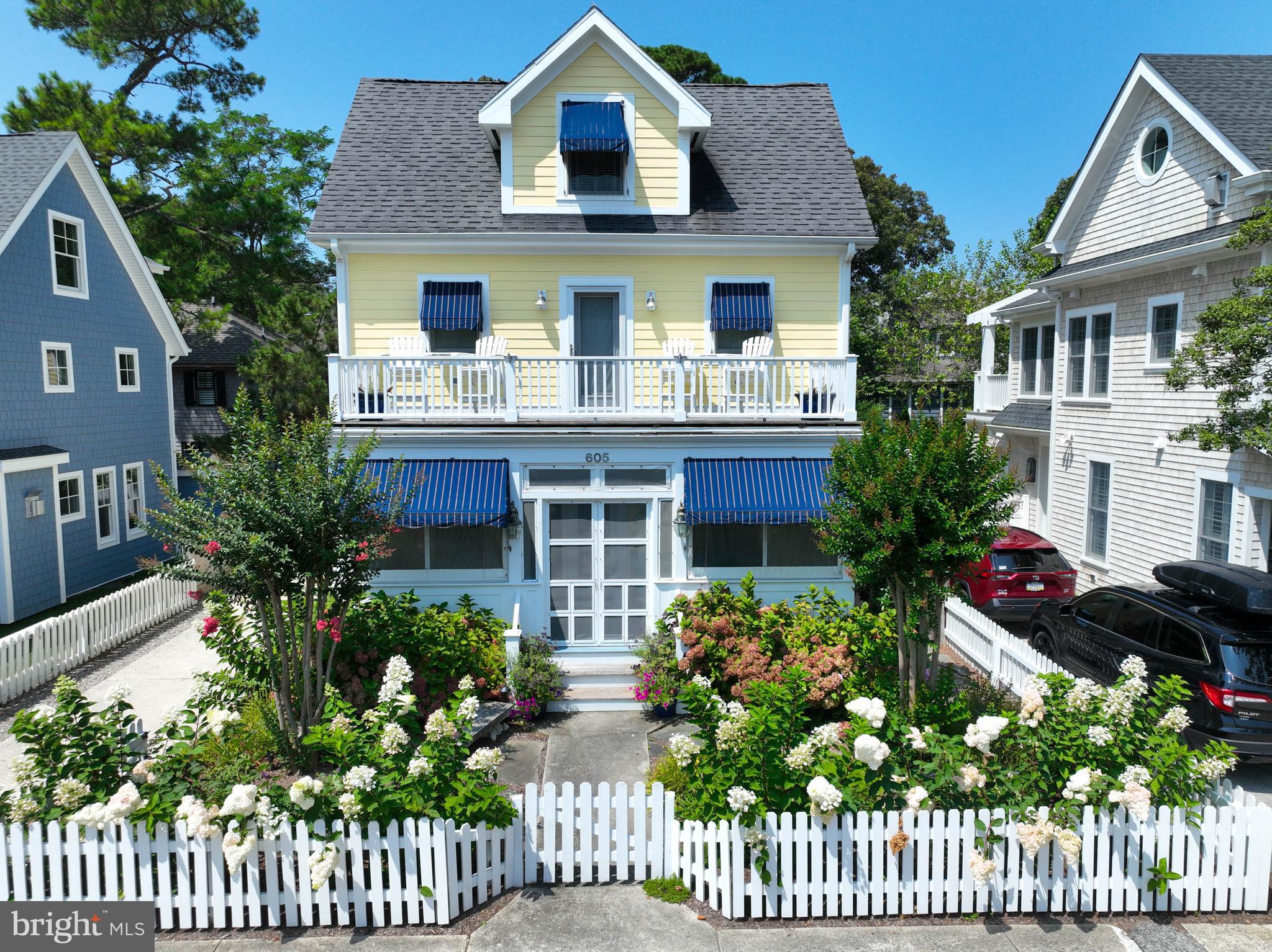 This stunning custom-built South Rehoboth home is just 1 block to the beach & located in one of Rehoboth’s most desirable neighborhoods. Expertly sited on King Charles between New Castle & Stockley St., this bright and airy home offers the ultimate in relaxed elegance with multiple outdoor living spaces that include a screened porch and 3 separate decks for entertaining or spending a lazy day reading a book and relaxing while smelling the salt air and listening to the ocean waves crashing against the shore. Watch the 4th of July fireworks from the front deck! The home's location is ideal, with easy access to the beaches in-town Rehoboth, downtown shops and restaurants, Gordons Pond State Park, the Delaware Bay beaches, and charming Historic Lewes. The extensive bike trail system also provides a great way to explore the local area. With 5 spacious bedrooms and 4 modern baths, this home allows enough room for the entire family or a large group of friends to be gathered at one time. On the 1st level you will find a modern kitchen with large dining area, additional counter seating, family room with gas fireplace, sunroom, 1st floor bedroom with attached full bath, large mahogany deck, a screened porch, separate laundry room with side entrance and an additional living area in the front of the home which offers direct access to the screened porch. An outdoor shower adds to the convenience of coming home from the beach, rinsing off and relaxing. This beach home offers multiple interior and exterior open spaces conducive to entertaining a large family or friends, or small intimate dinner parties. Additional amenities include a 2nd floor office/flex room, plantation shutters throughout, under-counter kitchen lighting, quartz countertops, gas fireplace, random plank pine flooring, multi-zone heating & cooling, large, floored attic space, security system, irrigation, outdoor landscape lighting package and a fully fenced yard. This 3350 sq. ft. home cannot be duplicated based upon current building specifications in-town Rehoboth. Sold furnished and ready to go for the 2024 season. Call for a private viewing today.
