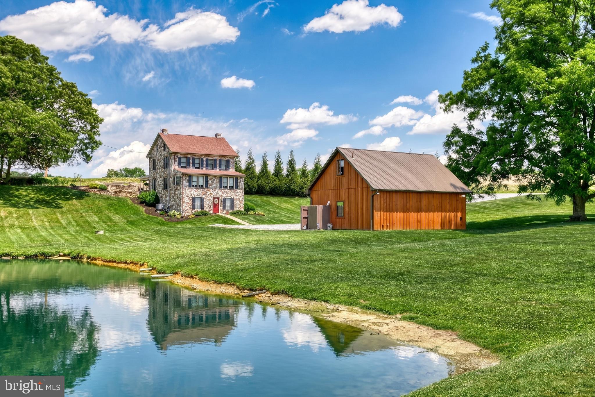Have you always dreamed of having a picturesque farmette in the middle of the country, down its own private lane, completely updated and cared for just waiting for you to immediately pick up where the previous owners left off?  Well this is that extremely RARE moment where that dream can instantly become your REALITY!!!!
Close to Maryland
ROUGHLY 11,000 SQ FT OF SPACE between 3 buildings TO ENJOY!!!
Just Shy of 10 Acres!!!
ENORMOUS POND!!!
AMAZING OPPORTUNITY with this ONE OF A KIND Setup!!!! 3 Fully Updated Buildings come with this spread!  The Turn of the Century Farmhouse has been completely restored and boasts 4 Nice Size Bedrooms and 2 Full Baths.  The original Charm is LOADED with restored finishes that captivate the PRIMITIVE feel that people just LOVE to see with these kinds of properties!  The Character and Craftsmanship that comes with this home is without a question something you definitely dont see everyday!  This home belongs in a magazine on every coffee table in America!  
You will never have to worry about what to do to spend your days here! Whether its tending to your livestock, cutting your grass and taking care of all the manicured landscaping this property has to offer or simply spending a gorgeous afternoon fishing in your private pond you will be in absolute HEAVEN spending your days in this personal oasis!
Main Barn Area with its own full bath and HVAC can be Used as its own Wedding Venue making this an opportunity to run business while you ENJOY everything this has to offer$$$  This space could also be used as a Bed and Breakfast allowing you to entertain people from far and wide as locations such as this are something often seen in fairy tales!
Below the main space there are 5 stalls for Horses/Goats/Cattle a workshop with its very own half bath provides Endless Opportunities depending on each persons unique desires and needs!  Seller has also installed a 220v outlet in the work area so if you are somebody that needs the extra juice to do your work its already set up for you to get right down to business$$$
Detached 2 car garage with upper office area is like having an entire home/business in its own right!  Equipped with its very own half bath and currently being used as kennel/home office space this is just one more feature to get excited over :)
I could literally go on for hours about all the limitless potential that comes with this AMAZING opportunity in the Heartland of York County!  Schedule your private tour today and make a day by getting to see this spread in all its glory!!!!