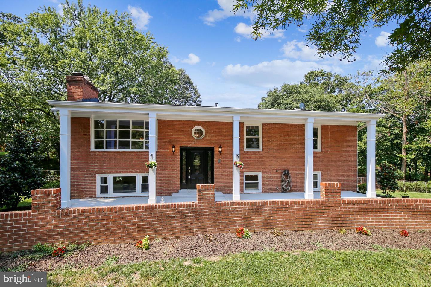 One of a kind in Alexandria! This stunning split foyer home offers 5 beds, 3 baths, and a sprawling 2,600 sq ft. The curb appeal is nothing short of spectacular, with an enormous welcoming front patio, two-story pillars, and a wrap-around driveway framed by custom landscaping .

This home is turn key with each spacious bedroom and bathroom having been transformed with modern touches throughout while preserving the home's innate classic charm! The main level is a showpiece, elevated above ground level with a center piece brick fireplace, gleaming hardwood floors, recessed lighting, updated light fixtures and a layout that effortlessly blends tradition with contemporary style living.

The kitchen has been fully revamped with tall white cabinets, stainless steel appliances, classic subway tile backsplash, and LVP flooring. But the excitement doesn't stop there – picture hosting gatherings on your expansive 20x30 elevated deck right off the kitchen!

Venture downstairs to the lower level, reimagined as a second living space with updated LVP flooring, a white brick accent wall, and a second fireplace. Step out onto the walk-out patio, seamlessly connecting you to the backyard. And as a delightful bonus, there's another rear walk-out from the laundry space for added convenience. The back yard offers dozens of options with its large flat rectangular shape, providing you with a large canvas to customize and optimize to your needs. Primely located near Franconia, Kingstowne, Van Dorn Metro, 495, I-395 Express, shopping, parks & much more! The driveway can hold up to 6-8 vehicles comfortably.