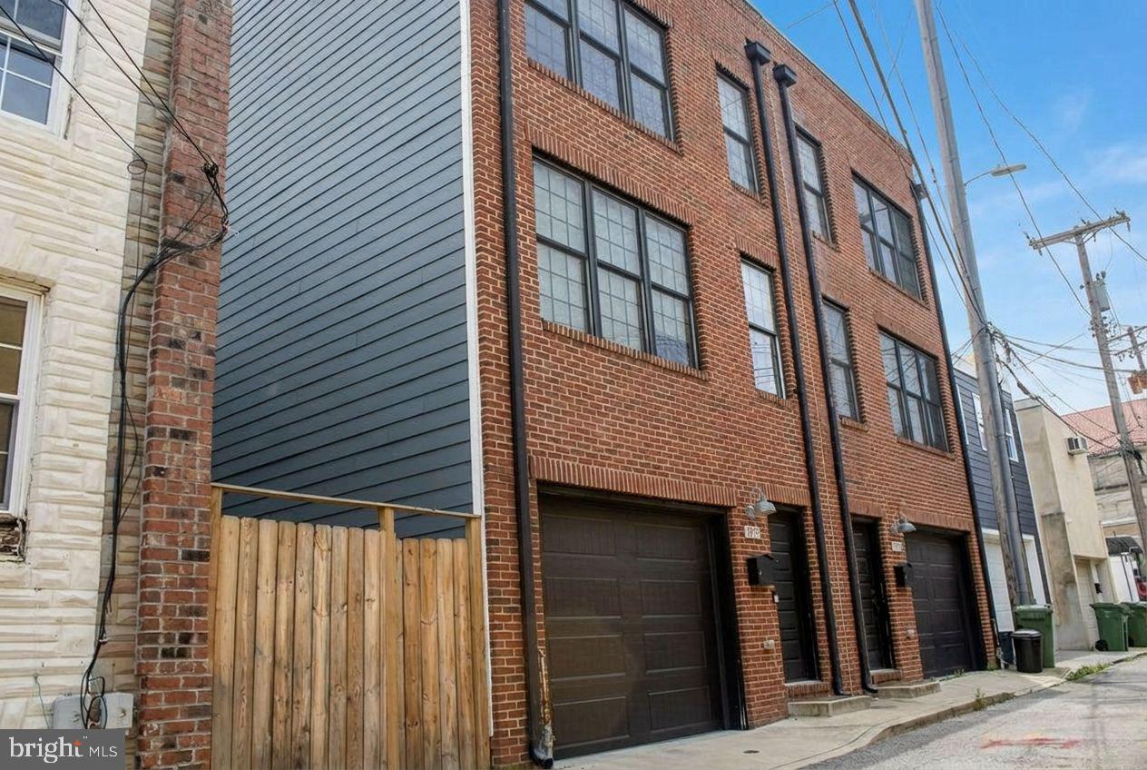 Exceptional Canton End-of-Group Townhome with Garage Parking, Roof Deck & Included Adjacent Lot.
Rarely does an opportunity like this become available in the heart of Canton. This stunning 3-bedroom, 3.5-bath end-of-group townhome offers the perfect combination of modern luxury, outdoor living, and valuable additional land ownership.
A truly unique feature that distinguishes this property from virtually every other Canton townhome is the inclusion of the separately deeded adjacent lot at 1001½ S. Belnord Avenue (Tax ID #0301081882 050), which conveys with the property and is included in the purchase price. This additional parcel offers enhanced privacy, flexibility, and long-term value in one of Baltimore's most sought-after neighborhoods.
Inside, you'll find thoughtfully designed living spaces ideal for both everyday living and entertaining. The upper level features a private bedroom and full bath, perfect for guests, multigenerational living, or a dedicated home office. The spacious primary suite offers a spa-inspired retreat complete with a luxurious rain shower and dual vanity, while an additional bedroom and full bath provide comfort and versatility.
Entertain effortlessly with a wet bar that opens directly onto the expansive roof deck, where breathtaking city skyline and water views create the perfect backdrop for gatherings, sunsets, and summer evenings.
Enjoy the ultimate Canton lifestyle—just moments from the waterfront promenade, parks, and marina, while being only a short stroll to the restaurants, boutiques, and vibrant nightlife of Canton Square.
Additional Parcel Included:
1001½ S. Belnord Avenue
Tax ID #0301081882 050
Conveys with the sale and is included in the list price.
Notice of Surveillance
Please be advised that there are active security cameras in and around the property, including the home and the adjacent lot. These cameras are in operation for safety and security purposes.
By entering the property, you acknowledge and consent to being recorded.