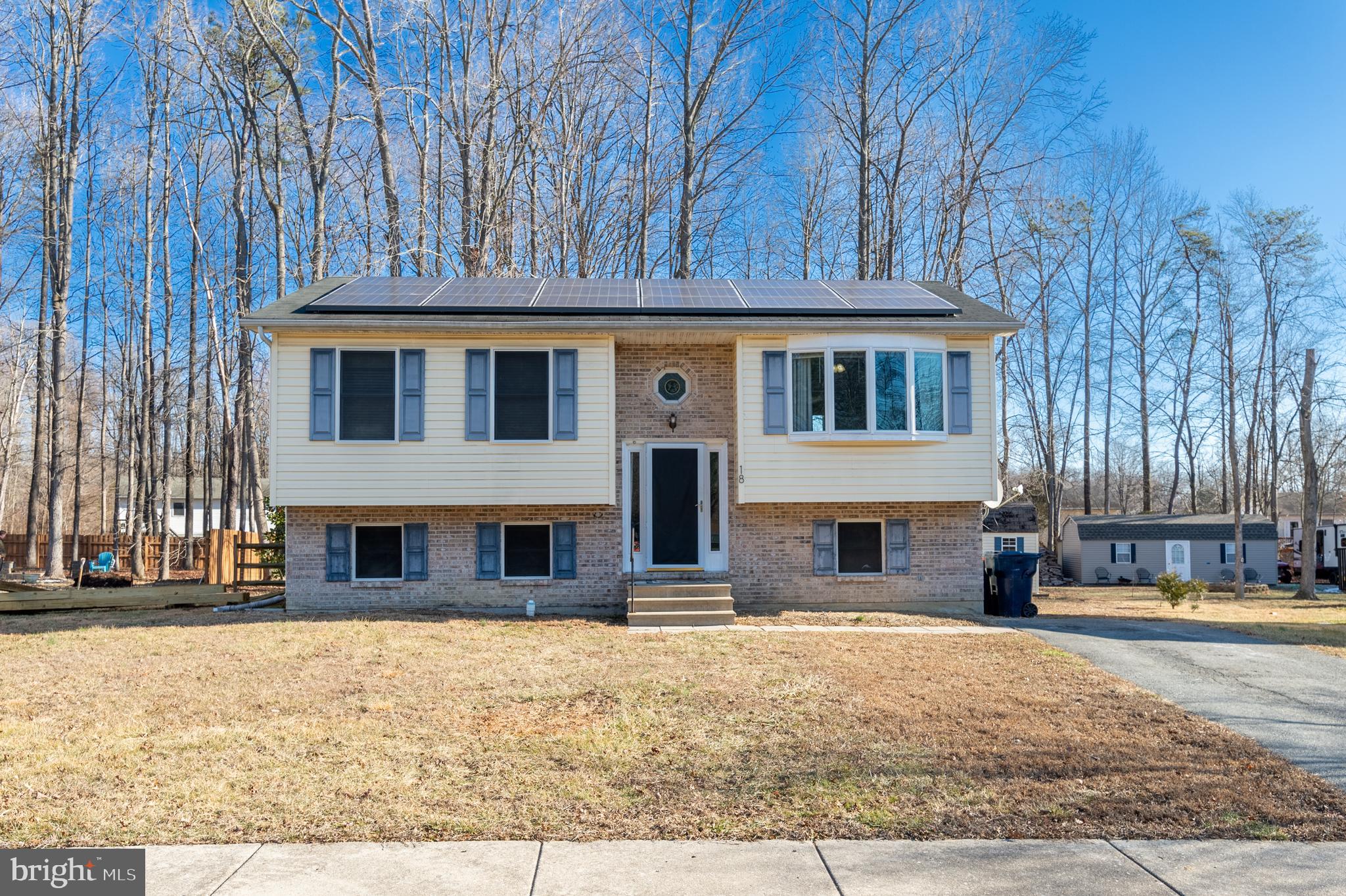 4 BEDROOM, 2 FULL BATH SPLIT FOYER  BILEVEL HOME. UPPER LEVEL HAS LIVING ROOM, EAT IN KITCHEN, WITH WALK OUT SLIDERS TO LARGE DECK AND BEAUTIFUL WOODED BACK YARD.  2 BEDROOMS AND FULL BATH.. FINISHED LOWER LEVEL WITH FAMILY ROOM (OR BEDROOM), BEDROOM, FULL BATH AND LAUNDRY ROOM. HOME HAS ANDERSON VINYL WINDOWS,  TESLA SOLAR PANELS AND .38 ACRE WOODED LOT. (ONE OF THE LARGEST LOTS IN THE COMMUNITY). SHED WITH ELECTRIC. THIS HOME  IS LOCATED WITH MINIMAL TRAFFIC, AS THE HOUSE IS LOCATED  ON A STREET WITH A CULDESAC!