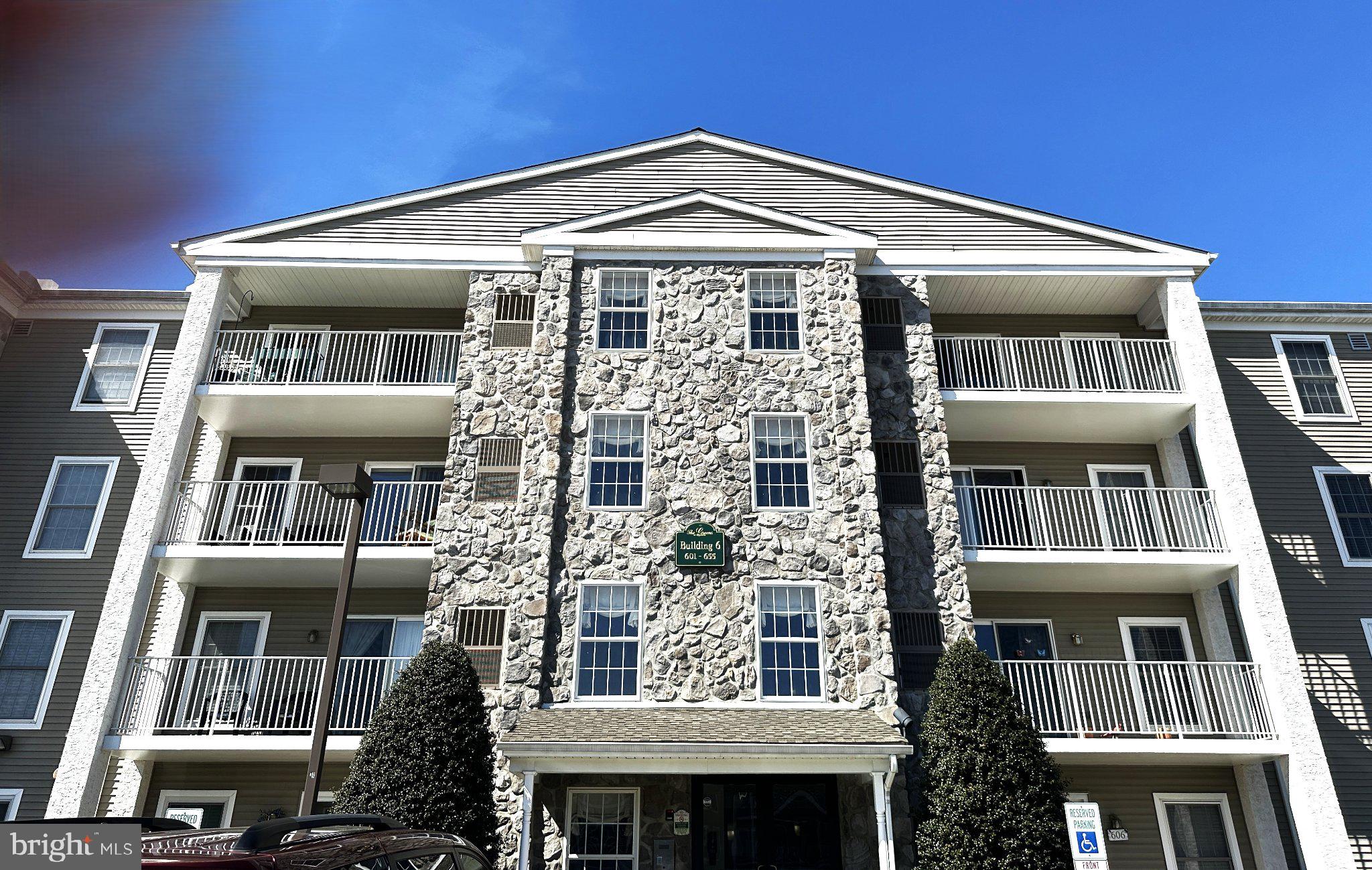 Welcome to The Greens at Westover, a sought-after 55+ community in Montgomery County near Westover Golf Course. This spacious 2-bedroom, 2-bath condo is one of the largest in the community, offering 1,209 square feet of comfortable, low-maintenance living. 

Located in an elevator building and set one floor above ground level, this well-maintained home offers accessibility and simplicity. It features an updated kitchen with added cabinetry and granite countertops with seating. Newer flooring has been installed throughout. The HVAC system has been updated. 

The living and dining areas are filled with natural light and open to a private covered balcony. The primary suite features a full bath and a walk-in closet, while the second bedroom and full hall bath provide flexible space for guests, a home office, or caregiver accommodations. Very generous closet space throughout, along with a separate laundry room, adds everyday practicality and storage.

Life here is especially appealing for buyers who want to leave behind exterior chores and ongoing home maintenance. The low $315 association fee covers exterior maintenance, water, sewer, trash, lawn care, and snow removal. The building also includes a locked private storage area.

Residents enjoy amenities that support both activity and relaxation, including an indoor pool, fitness center, library, clubhouse, and meeting room. Conveniently located near King of Prussia, Valley Forge Park, the Schuylkill walking trails, shopping, and dining, this home offers easy access to everyday essentials and recreation.
