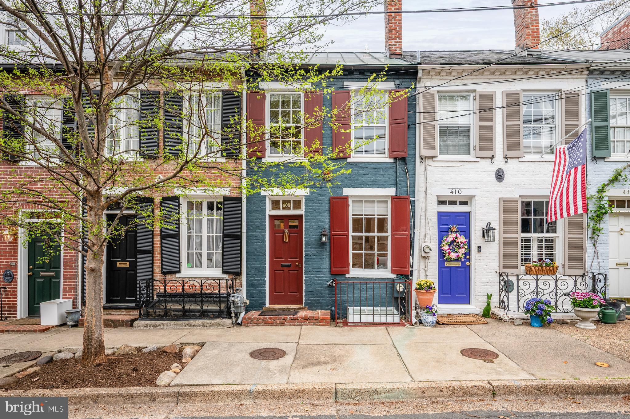 Welcome to South Lee Street, one of Old Town, Alexandria's most sought-after addresses.  This delightful & charming historic property is nestled in this superior location,  just two blocks up the hill on Wolfe Street from the piers of the Potomac river.  Offering 3 bedrooms + 2 full baths on 3 levels, find a quaint, lovely  home that may be "just right". Handsome wood flooring on 2 levels. Family room  fireplace. A sleeping loft, above bedroom #2. Double French doors, opening from the kitchen to the patio, a private "summertime room".
Fresh paint throughout and many custom built-ins for great storage make this home move-in ready. You will love it.
