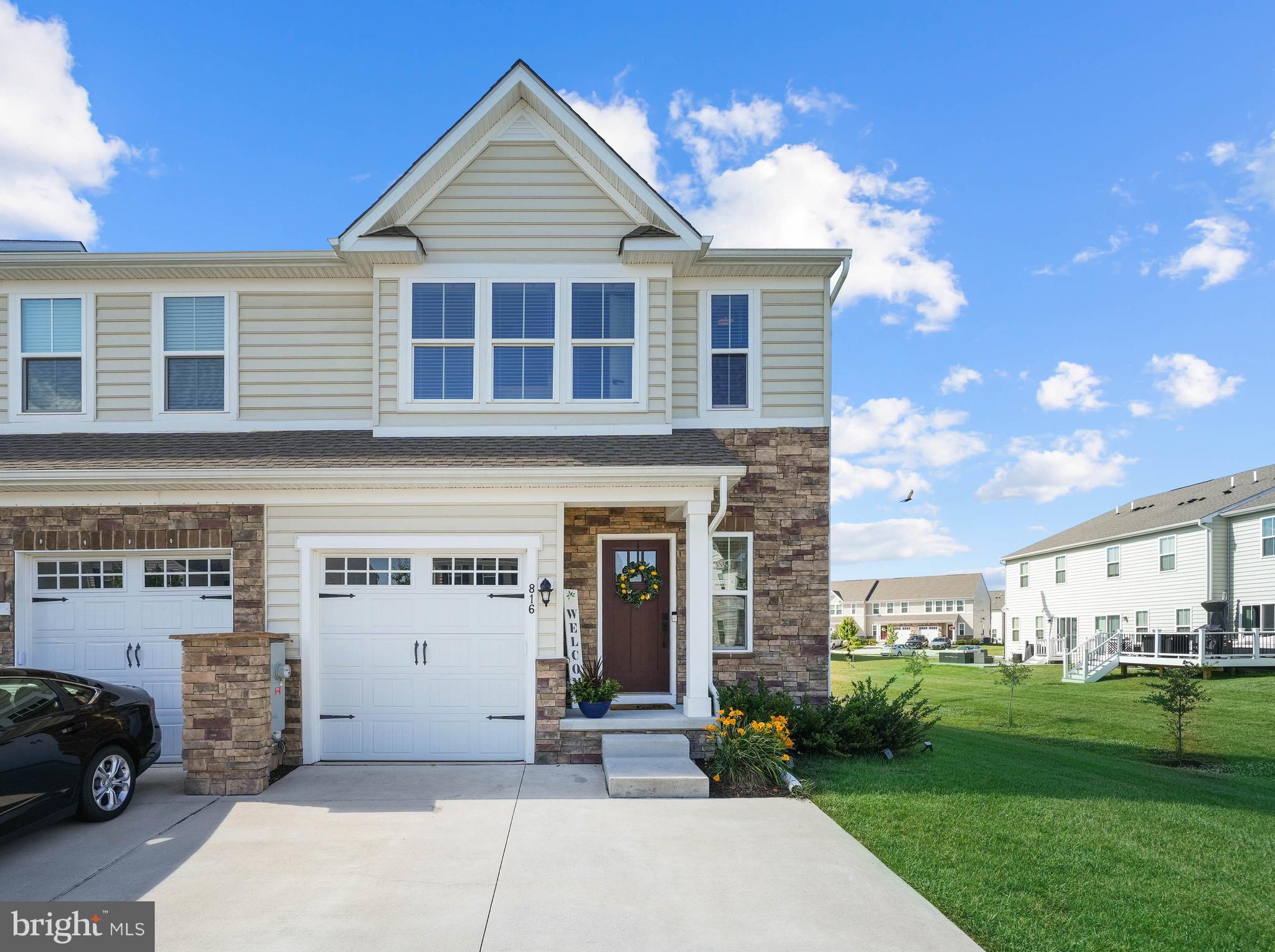 Better than new, this home is ready for you!  Gorgeous end-unit townhome in the community of The Preserve at Deep Creek.  Built in 2022 and carefully maintained, this 3 bedroom 3 full and 1 half bath home with a finished basement will check every box.  Extra light, extra indoor space, and extra outdoor space come standard with this home.  The main level of the home has the modern kitchen complete with stainless steel appliances, ample storage, and workspace. The kitchen opens to the living / family room which opens on to the deck overlooking open space. On the upper level you'll find a sumptuous owner's suite with full bath featuring a walk-in shower, a walk-in closet (currently outfitted for a nursery), 2 additional bedrooms and full bath, plus the laundry room.  The finished lower level can be used as a bedroom with the coveted egress window already installed. You'll find a full bath on the lower level as well.