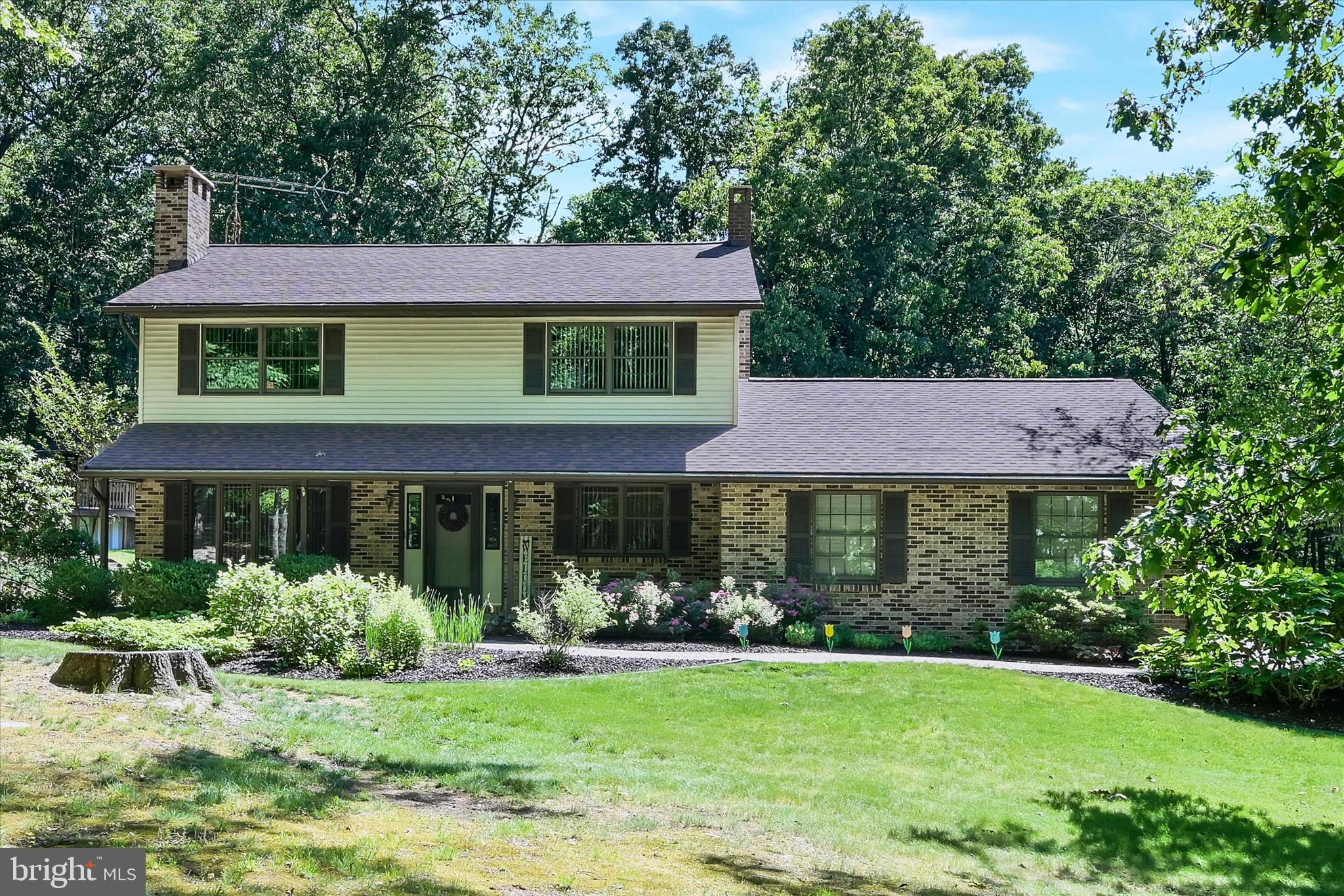 Nestled on a 1.4 acre lot and surrounded by mature trees, this beautiful property offers the perfect blend of privacy, space, and comfort in the highly desirable Schuylkill Haven Area School District. The home features three bedrooms with the potential for a fourth bedroom in the spacious study, providing flexibility to fit your needs. Inside, you'll find inviting living spaces and a finished lower level complete with a bar area perfect for entertaining family and friends. The primary bedroom includes a bonus room that   offers access to a private deck overlooking the above ground pool and surrounding landscape.  This space formerly housed a hot tub but now offers endless possibilities for a private sitting area, home gym, office, nursery, or possibly an en suite bathroom. The pool features a large wrap around deck for relaxing in the sun.  A second garage provides additional convenience and storage. 
Additional highlights of this well cared for home include a large two-car garage, ample outdoor space, and a private wooded setting that creates a true retreat while still being conveniently located near local amenities. Don't miss this opportunity to make this secluded Schuylkill Haven property your own!