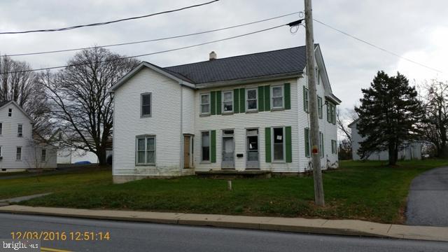 Detached home on almost 1 acre lot with a barn. This is a 2-story with an unfinished 2-story addition for a total of almost 3000 SqFt. This property has lots of potential with mixed use zoning. Backs up to Park. Condition is poor and not for the weekend warrior.