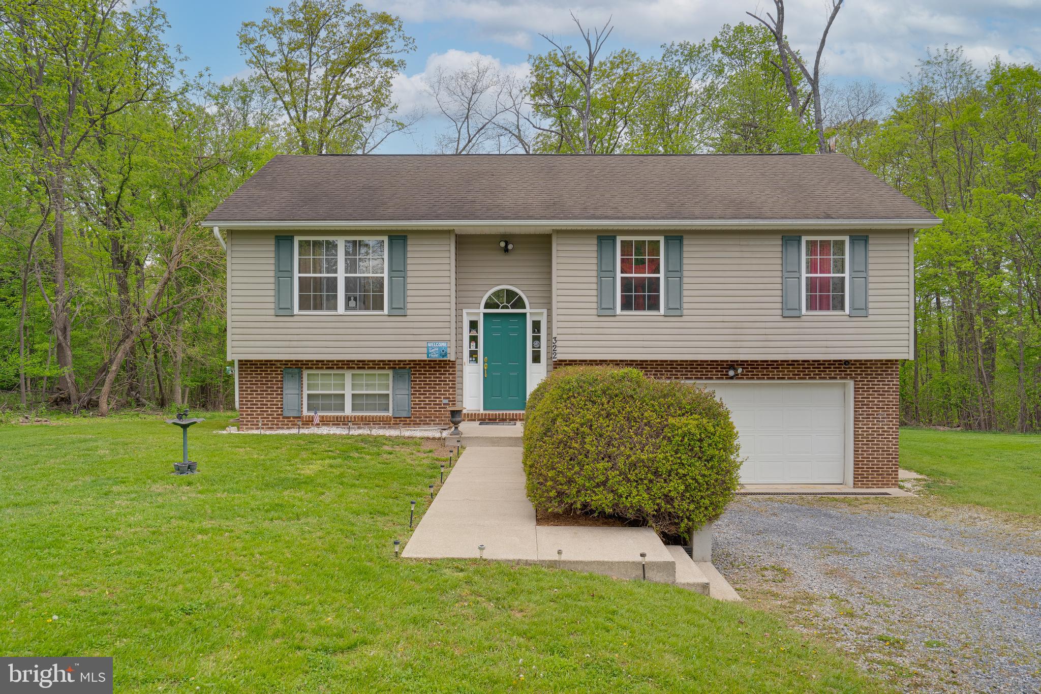 *Multiple offers received! Please submit Highest & Best offers by 6pm on Sunday, May 4th.*
Welcome home to this charming one-owner 3-bedroom, 2-bath split foyer, perfectly situated on a beautiful 1.01-acre lot in a peaceful country setting. Step inside to a light and bright living room that flows seamlessly into the open kitchen and dining area — ideal for both everyday living and entertaining. Enjoy morning coffee or evening sunsets on the deck just off the dining space.

The spacious 2-car garage offers convenience, while the unfinished basement — already roughed in for a bathroom — provides endless possibilities for additional living space. This property is also thoughtfully set up for underground dog fencing, perfect for pet lovers.

Located close to major commuter routes, yet offering a true sense of country serenity, this home belongs to a welcoming subdivision featuring community river access Don’t miss your chance to enjoy the best of both worlds — peaceful living with modern conveniences nearby!