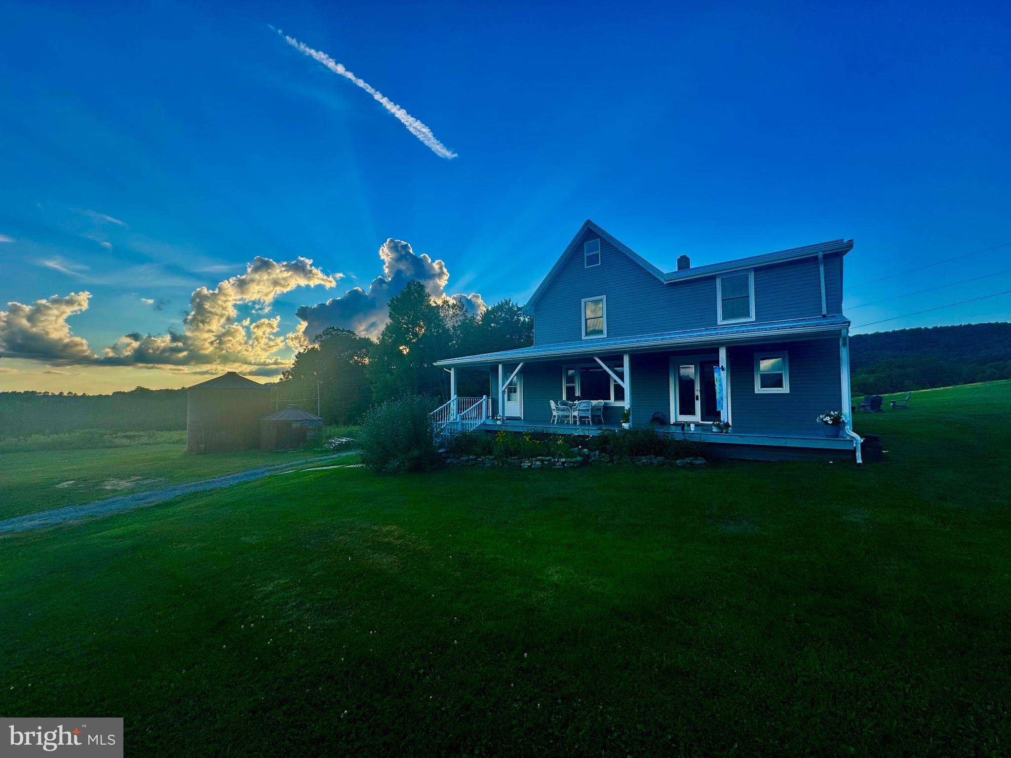 Charming 1890's Renovated Appalachian Farmhouse Retreat with Income Potential on 180 +/- ACRES! Welcome to your dream escape nestled in the heart of the picturesque Appalachian Mountains! This stunning 1,700 sq ft renovated farmhouse is a perfect blend of rustic charm and modern convenience, offering an exceptional lifestyle for those looking to invest in a serene countryside property. With 3 spacious bedrooms and 2 beautifully appointed bathrooms, this home is designed for both comfort and functionality. This property is not just a home; it’s an opportunity! With significant rental and wedding income potential, you can capitalize on the stunning backdrop of panoramic mountains and the scenic beauty of a truly incredible farm. Imagine hosting unforgettable events or welcoming guests to your charming retreat! Spanning approximately 180 acres, this beautiful farm offers a blend of nature and productivity. With 50 +/- acres of fertile crop fields and numerous spring-fed creeks feeding a private pond, there’s ample space for farming, recreation, or simply soaking in the tranquility of your surroundings. An additional home site complete with a drilled well awaits your creative vision, offering breathtaking panoramic views that will leave you in awe. Experience peace of mind with state-of-the-art amenities, including a spring water filtration system equipped with ultraviolet light filtration, providing pure and clean water. The upgraded 200 amp electric service ensures that your home runs smoothly, accommodating all your modern conveniences. The detached garage provides ample storage space for your vehicles and tools, while the rustic silos add a touch of historical charm, perfect for those who appreciate unique features that tell a story. Situated close to Alpine Lake & Deep Creek Lake, this property is not only a serene retreat but also offers easy access to outdoor activities such as hiking, fishing, and water sports. The vibrant community of Bruceton Mills and I-68 are under 20 miles away. Imagine waking up to the melodies of nature, sipping coffee on your front porch, and enjoying the stunning views that change with the seasons. Step out the back door to your private fire pit and enjoy your favorite drink with company. Don’t miss your chance to own a slice of Appalachian paradise! Contact us today for a private showing and embrace the lifestyle you’ve always dreamed of! 4 +/- miles to Alpine Lake Resort. 15 +/- miles to Deep Creek Lake, MD & Wisp Resort. 35 +/- miles to Morgantown. 55 +/- miles to Bridgeport/ North Central West Virginia Airport.