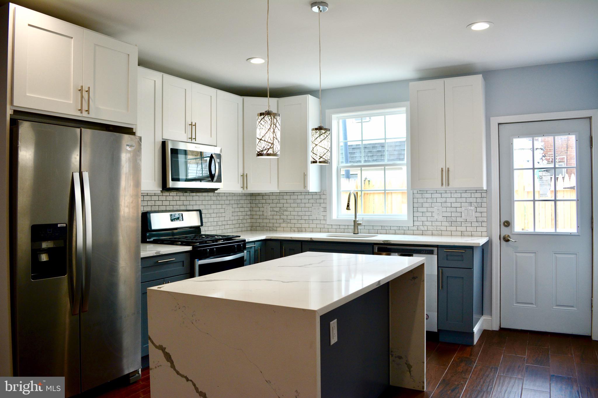 Tilton Street Never Looked so Good! Fresh renovation like new construction, 2 Large Bedroom 2 Full bath Townhome in quaint section of 19125, close to everything shopping/restaurants/bars/95 and of course the Development of The Delaware River Waterfront just 2 block away make this a prime location for settling down before the prices go up.  Enter your new home to an open concept first floor with amazing light streaming through from the front and back. The owner spared no expense in the selections and attention to detail of this sleek and modern townhome with full finished basement. Brand new everything SS appliances, granite and tile with waterfall island, dishwasher, garbage disposal and a generous assortment of cabinets economically and efficiently arranged for maximum functionality. The back yard is neat and clean with new concrete and fencing, you can arrange an inviting outdoor room/lounge/eating  area with barbecue, and if you are a plant lover, plenty of sunlight will enable you to enjoy a lovely potted garden. The fully finished downstairs could be a master bedroom/movie/living  room or office with tiled floors, full bath/ laundry and large egress window.  Upstairs you have 2 large bedrooms with ample amounts of closet space along with a huge bathroom with double vanities and tiled stall shower. Come take a look and imagine the possibilities when you move in and make this wonderful neighborhood your home with easy access to all major roadways and public transportation and within walking distance to popular restaurants such as famous Tacconelis Pizza, Memphis Taproom, Philadelphia Brewing Co., Tired Hands, Hinge Cafe, and Stock's Bakery, plus Fishtown Crossings (to name a few). Aramingo Square is also walking distance including Cione Playground and close proximity to Penn Treaty! Do not miss your chance to own this truly special home in lively Fishtown!