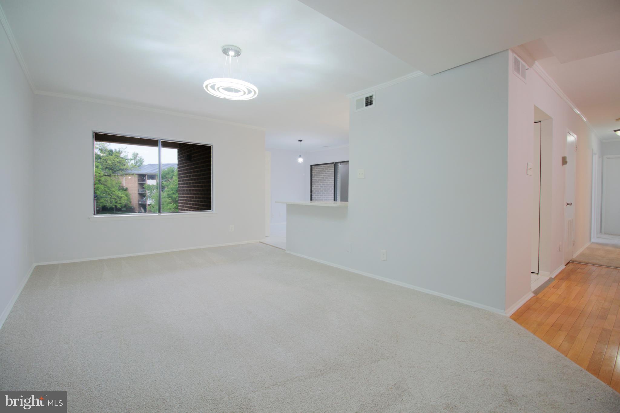 Welcome to elegant living at Cherry Glen Condominiums in this beautiful, move-in-ready home featuring 3 spacious bedrooms and 2 full bathrooms. Freshly painted with new carpet throughout the major living areas. The unit opens into a bright living and dining space accented by contemporary light fixtures. The upgraded kitchen is a standout, boasting quartz countertops and a stylish backsplash installed in 2021, complemented by a versatile bonus space perfect for a home office, play area, or breakfast nook. The primary suite offers a private retreat with a walk-in closet and en-suite bath, while two additional bedrooms share a beautifully updated hallway bathroom. An in-unit washer and dryer provide extra convenience. Gas and water are covered in the condo fee.  Owner pays electricity and internet only.  With major 2026 updates including a new HVAC system, new carpet, fresh paint, and a renovated bath, this home offers total peace of mind. Perfectly situated near I-95 and I-495, you are just minutes from Target, Giant, ALDI, local dining, Beltsville Community Center, and the University of Maryland.