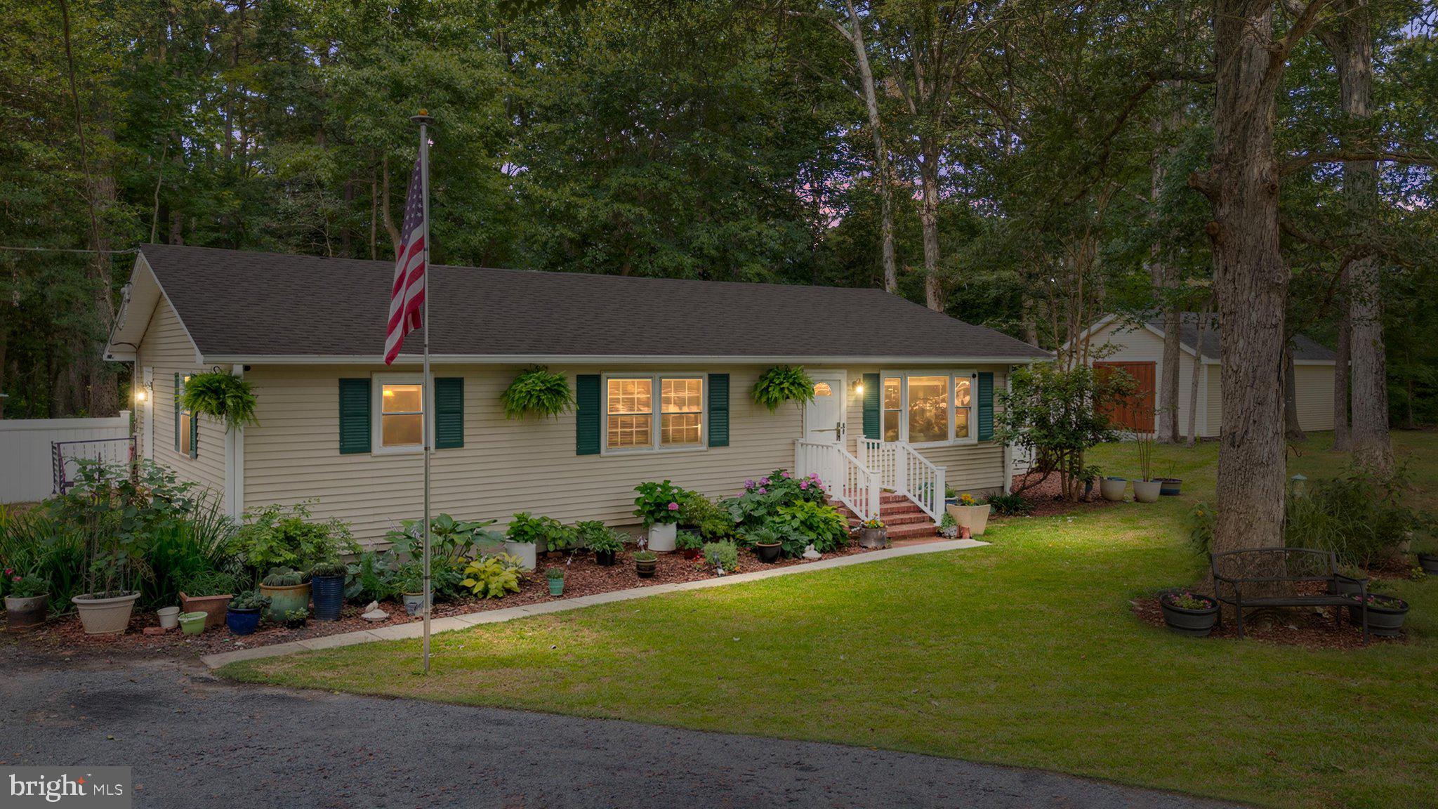 Welcome to this thoughtfully updated rancher in Trappe, Maryland, offering Eastern Shore charm, impressive outbuildings, and convenient access along Ocean Gateway/Route 50 — close to Easton, Cambridge, Oxford, St. Michaels, shopping, dining, waterfront destinations, and everyday conveniences. Ocean City day trips are only an hour away! From the moment you arrive, the property makes a memorable impression with a maniucured established perennial garden, flagpole, security doors, a brand new roof (2026), new windows (2022), and flexible outdoor storage including a 12x24 hobby shed with an upper level offering ample storage space. Inside, the home offers comfortable one-level living with a brand new, fully insulated 225 sq. ft. sunroom (2026)  that expands the living space and creates the perfect spot to relax, entertain, or enjoy natural light year-round. Brand new whole house split sytem (2026) is extremely efficient offering both AC and heat in addition to baseboard heating. The renovated kitchen is designed with both style and function in mind, featuring a large island with Boos Block countertop, granite counters, new cabinets, farm sink, recessed lighting, 30-inch gas stove, built-in pot filler, and range hood. A mudroom/pantry/butler’s pantry adds valuable storage and everyday convenience while keeping the layout efficient. The updated bathroom brings a spa-like feel with a soaking tub, walk-in shower with bench, dual sinks, and built-in shelving. Every detail has been thoughtfully considered to blend charm, practicality, and modern comfort. One of the true highlights of this property is the hand-built 24x36 workshop / barn, complete with handcrafted 10x10 IPE wood carriage doors which allow boat storage, RB storage, wood shop, etc. This heated workshop has a concrete floor, water hookup, electrical service is both 120/230V with 60 amp sub panel service- high intensity lighting, 120v and 230v receptacles for equipment- at the rear of the workshop you will find a 8’x7’ roll up garage door for vehicle access— offering incredible flexibility for storage, hobbies, workshop space, equipment, or creative use. With major updates, a functional rancher layout, standout storage, a beautiful new sunroom overlooking the expansive landscape, and a highly convenient Eastern Shore location on Ocean Gateway, this Trappe property offers a rare combination of comfort, character, and utility. Schedule your tour today and see everything this unique property has to offer.