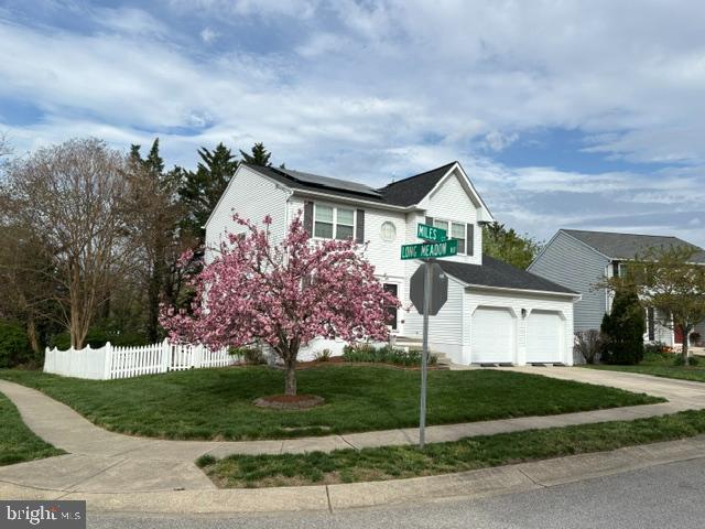 VA assumable loan with 2.25% interest rate for qualified buyers. Contact your lender.....  Hot Water Heater, 2026, Roof and solar panels, 2022, Sump Pump, 2023,  Microwave, 2025,  Gas Fireplace , 2018,  Minisplit, Gym Mirrors, 2020,  Garage interior, 2019. ...Solar panel system will be fully paid off by the seller at closing....    Location and lifestyle come together beautifully in this thoughtfully updated  Colonial, where classic  style has been enhanced . The kitchen opens to the family room, creating a warm and inviting space for gathering and entertaining. It features granite countertops, stainless steel appliances, and abundant cabinet space. A sunlit living room and formal dining room provide an effortless flow throughout the main level, offering both comfortable daily living and an ideal setting for hosting guests. Upstairs, three bedrooms share a full hall bath, while the spacious primary bedroom includes a private ensuite bath. The lower level adds exceptional flexibility with a office or gym and additional space that can easily serve as a recreation room, home theater, gym, or whatever best suits your needs. A separate storage room with its own exterior entrance adds even more convenience. Enjoy summer cookouts and outdoor entertaining on the deck. The fenced rear and side yards provide wonderful space for play, pets, and gardening.  Just a short walk to Harting Farm community pool.  Ideally located minutes to downtown Annapolis and major commuter routes including Routes 50 and 97, this home offers easy access to Washington, D.C., Baltimore, Fort Meade, shopping, and dining. Anne Arundel Community College is within walking distance, and the Bay Bridge is nearby for quick getaways to the Eastern Shore and the beaches.