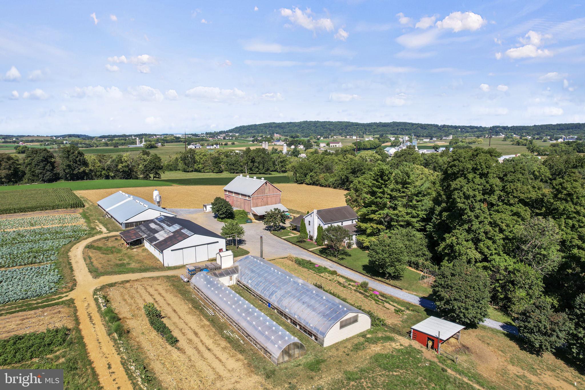 Charming 33-Acre Produce Farm in Ephrata, PA

Discover the potential of this stunning 33-acre farm, ideally situated in the heart of Ephrata. Perfect for produce farming, the gently sloping fields provide ample space for cultivation. The property features a spacious 5-bedroom, 1-bathroom home with 3,000 square feet of comfortable living space.

Property Highlights:

Bank Barn: 40x64 feet with an overhang, ideal for storage or livestock.
Equipment Shed: 48x80 feet, including a 20x28 foot workshop for all your tools and machinery.
Duck Barn: A fully remodeled 50x136 foot barn, updated in 2022.
Greenhouses: Two greenhouses—one 30x96 feet and another 15x96 feet—to support your growing operations.
Yanmar Diesel Generator: Reliable power source to meet your farming needs.
Storage Tanks: Five 500-gallon air tanks and one 1,000-gallon propane tank for all your storage requirements.
Solar System: A 1,000-watt solar system for energy efficiency.
Irrigation System: A 3-inch underground irrigation system, with water pumped from Conestoga Creek to ensure consistent watering.

This well-maintained farm is ready for your produce-growing ambitions, with all the necessary infrastructure already in place. Don’t miss this opportunity to own a productive farm in a prime location.

Open House:
September 20, 2:00 PM to 6:00 PM
October 4, 2:00 PM to 6:00 PM