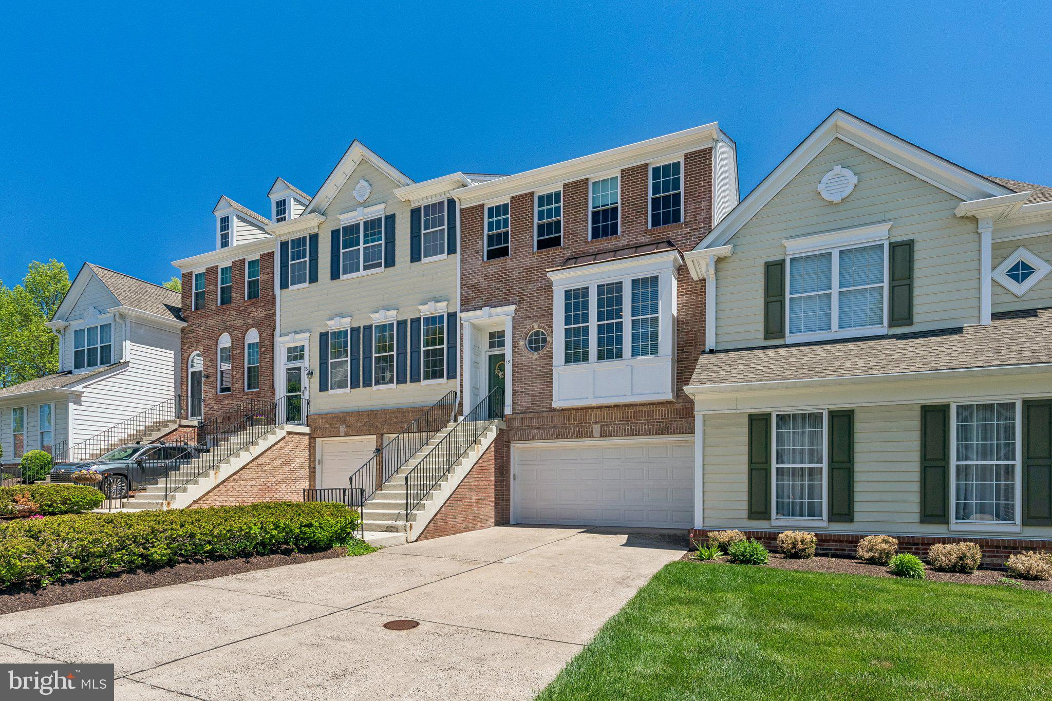 Welcome to 15 Charter Oak Court, located in the highly desirable Doylestown Station community. This beautifully cared-for townhome offers more than 2,000 square feet of comfortable living space, featuring 3 bedrooms, 3.5 bathrooms, and a layout designed for both everyday living and entertaining. From the moment you step inside, you’ll notice the bright and inviting atmosphere, with a welcoming foyer, convenient powder room, and extra storage space. The spacious kitchen offers plenty of cabinetry, generous countertop space, a pantry, and a sunny breakfast area surrounded by natural light from oversized windows. Just beyond the kitchen is the dining area, thoughtfully positioned to overlook the sunken living room below, creating an open feel while still giving each space its own character and definition. The living room is warm and inviting, highlighted by a cozy fireplace and direct access to the upgraded Trex deck, the perfect spot for morning coffee, outdoor dining, or relaxing evenings. Hardwood flooring, crown molding, custom trim details, and elegant wainscoting add timeless charm throughout the main level. Upstairs, the spacious primary suite serves as a relaxing retreat with a large walk-in closet and an en-suite bathroom complete with a soaking tub and separate shower. Two additional bedrooms, a full hallway bathroom, and second-floor laundry provide practicality and convenience for daily life. The finished lower level offers flexible additional living space ideal for a family room, home office, gym, or guest area, along with walkout access to a private patio. This level also connects to the attached 2-car garage and additional storage space.
Located within the award-winning Central Bucks School District, the home is just a short walk to Central Park through nearby walking trails, providing easy access to Kids Castle, open green space, playgrounds, and the outdoor amphitheater with summer concerts and events. You’re also only minutes from the heart of Doylestown Borough, known for its restaurants, shopping, museums, and year-round community events. This is a fantastic opportunity to own a move-in-ready home in one of Doylestown’s most sought-after neighborhoods.