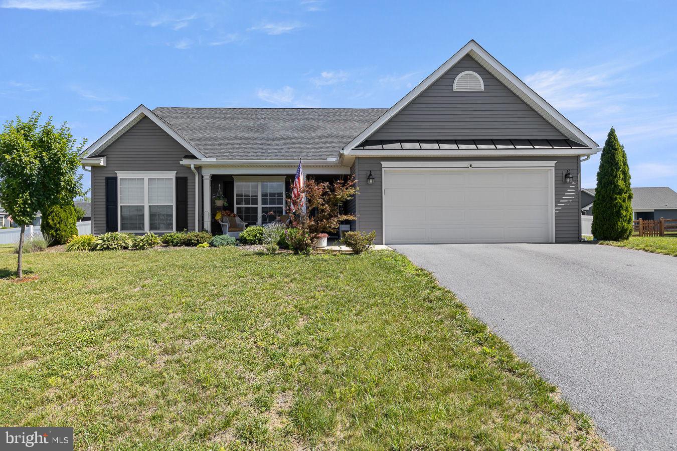 Nestled in the highly sought-after Bridle Creek community, this stunning ranch-style home, built in 2020, perfectly combines modern elegance with comfortable, single-level living. Featuring 3 spacious bedrooms and 2 full bathrooms, the thoughtfully designed open-concept floor plan offers seamless flow for both everyday living and entertaining. The stylish kitchen showcases slate appliances, generous counter space, and abundant cabinetry. The adjoining living and dining areas create a bright, welcoming atmosphere ideal for gathering with family and friends. Step outside to a beautifully landscaped, fully fenced 0.28-acre corner lot that provides exceptional privacy, curb appeal, and outdoor enjoyment. Residents of Bridle Creek enjoy access to outstanding community amenities, including walking trails, basketball courts, playgrounds, and well-maintained common areas, offering the perfect balance of recreation and relaxation. Don't miss your opportunity to make this beautiful home your own—schedule your private showing today!