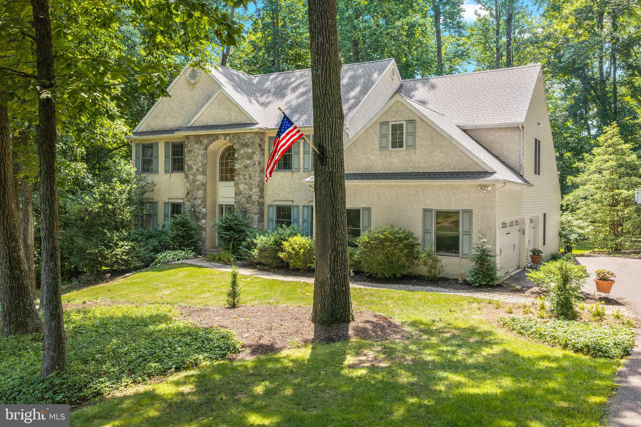 This ‘Barton Meadows’ gem is charmingly nestled on a 2 acre wooded lot that backs to a stream and quiet farmland, providing the perfect blend of privacy and community in a well established welcoming neighborhood.  This idyllic home is located within the highly sought after Owen J. Roberts School District and is in close proximity to several highly rated private schools as well.  Enter the grand two story entrance foyer with turned staircase and hardwood floors.  To the right is a private office/study with glass french doors.  To the left is the light and bright formal living room that flows into the spacious formal dining room overlooking the delightful and secluded rear yard.  The gourmet kitchen with hardwood flooring boasts 42” cabinetry, an oversized island, granite countertops plus separate eating area.  Step down into the oversized family room with vaulted ceiling and cozy fireplace.  The screened-in porch and side deck, overlooking the rear park-like setting, is accessed from both the family room and kitchen, offering a great flow for entertaining or simply enjoying the peaceful views.  The second level boasts the primary suite, a lavish primary bath with soaking tub, walk-in shower and ample closet space.  Three additional bedrooms, one with a very large walk-in closet, and a full bathroom complete this area.  A convenient rear staircase leads to the first floor FR.  The finished walk-out lower level boasts a second powder room, an additional room for secondary office space, and a spacious flex area that can be used as a playroom, home-gym, and more.   A large unfinished area offers tremendous storage. Another added feature is the attached 3-car side entry garage.  The fabulous outside grounds offer unmatched privacy and serenity within a very coveted neighborhood.   Conveniently located to a myriad of shopping, parks, restaurants, and all major commuting routes.