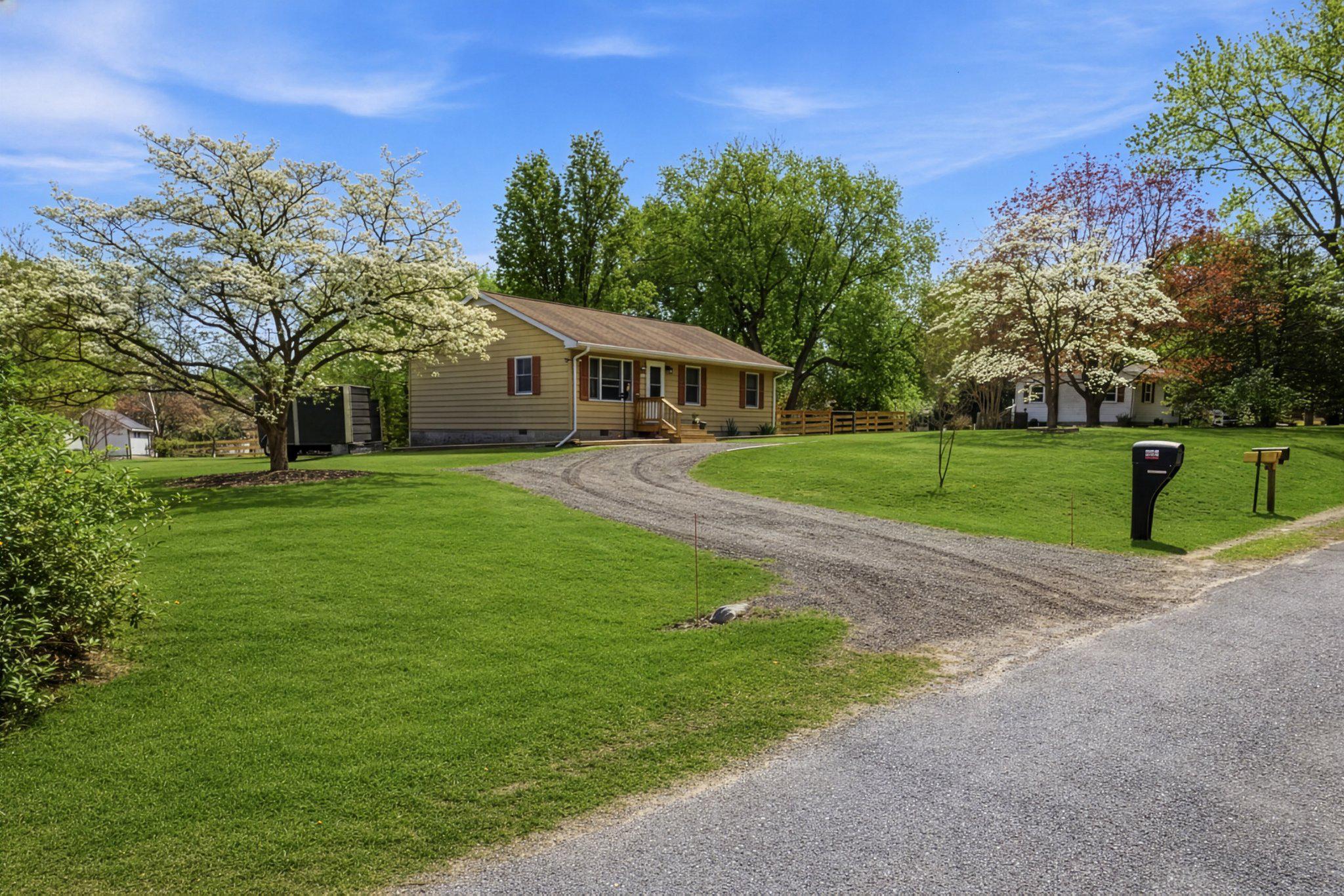 Welcome to 208 Central Drive, located in the desirable Chester Harbor community just minutes from historic Chestertown. This charming 3-bedroom, 1-bath home offers a wonderful blend of comfort, convenience, and value. It sits on 3 lots totaling approximately 0.55 acres, surrounded by mature trees and landscaping. Step inside to a bright, move-in-ready interior featuring brand-new wood flooring (2025) in the living room, hallway, and first bedroom. The home was thoughtfully updated with new lighting and ceiling fans throughout (2024–2025). The bathroom has been fully updated with a new tub/shower combination (2024), a stylish vanity, updated lighting and mirror (2024), a newer toilet (2023), and new flooring (2024). The kitchen includes a reverse osmosis water filtration system (2023), a new water filter (February 2026), and a stove/oven that is approximately five years old. Major systems have also been addressed, including a new water heater (2025), septic system inspection and pumping (2025), and three new electric heating units (2023). Outside, the expansive yard is a standout feature. Recently landscaped in 2024 and enhanced with fresh grass seed and treatment in 2025, the property offers plenty of space to enjoy. Outside includes a crab apple tree, a fig tree, a white pear tree, 2 white dogwood trees, and forsythia. Brand new rear screen door (2026) and a newly installed rear fence (2025) enhance both privacy and functionality, creating an ideal setting for relaxing or entertaining. Set on a generous lot with thoughtful updates throughout, this property offers exceptional value in a prime location just minutes from historic Chestertown, shops, dining, and waterfront. Enjoy water access to Rosin Creek in the community, which adds to the home’s appeal for outdoor enthusiasts.