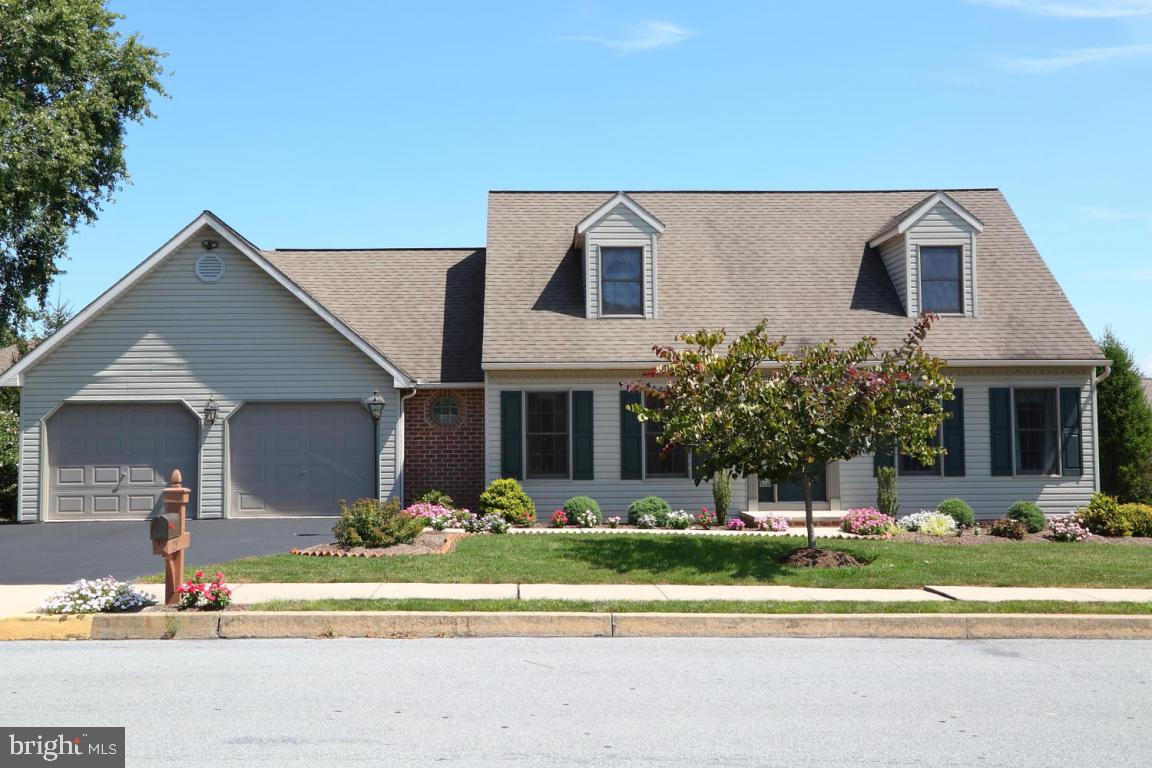 Lovely Cape Cod with spacious kitchen/dining area.  An abundance of cabinets with island.  1st floor laundry, 2-car garage, C/A and gas heat.  Walk-out to generous deck.  Move-in ready.