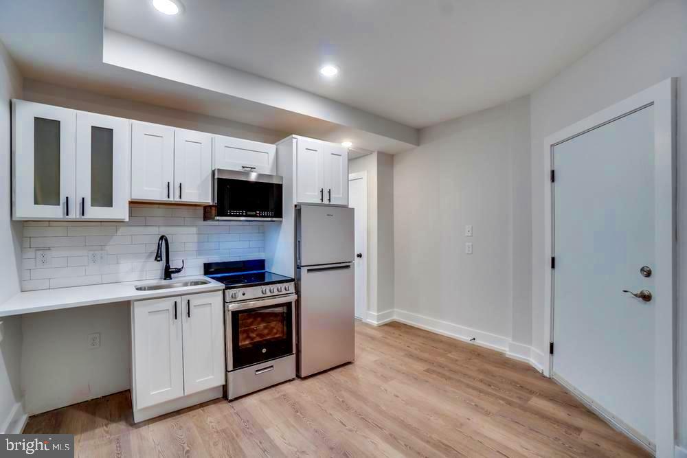 Freshly remodeled and filled with natural light, this spacious 1-bedroom plus den unit at 3126 16th St NW offers modern comfort in a prime Columbia Heights location. The open-concept layout features new flooring, recessed lighting, a sleek kitchen with stainless steel appliances and quartz countertops, and a contemporary bathroom with stylish finishes. The versatile den is perfect for a home office or guest space, and the large windows throughout bring in ample sunlight. Enjoy the convenience of an in-unit washer and dryer. Tenant pays for electricity.
