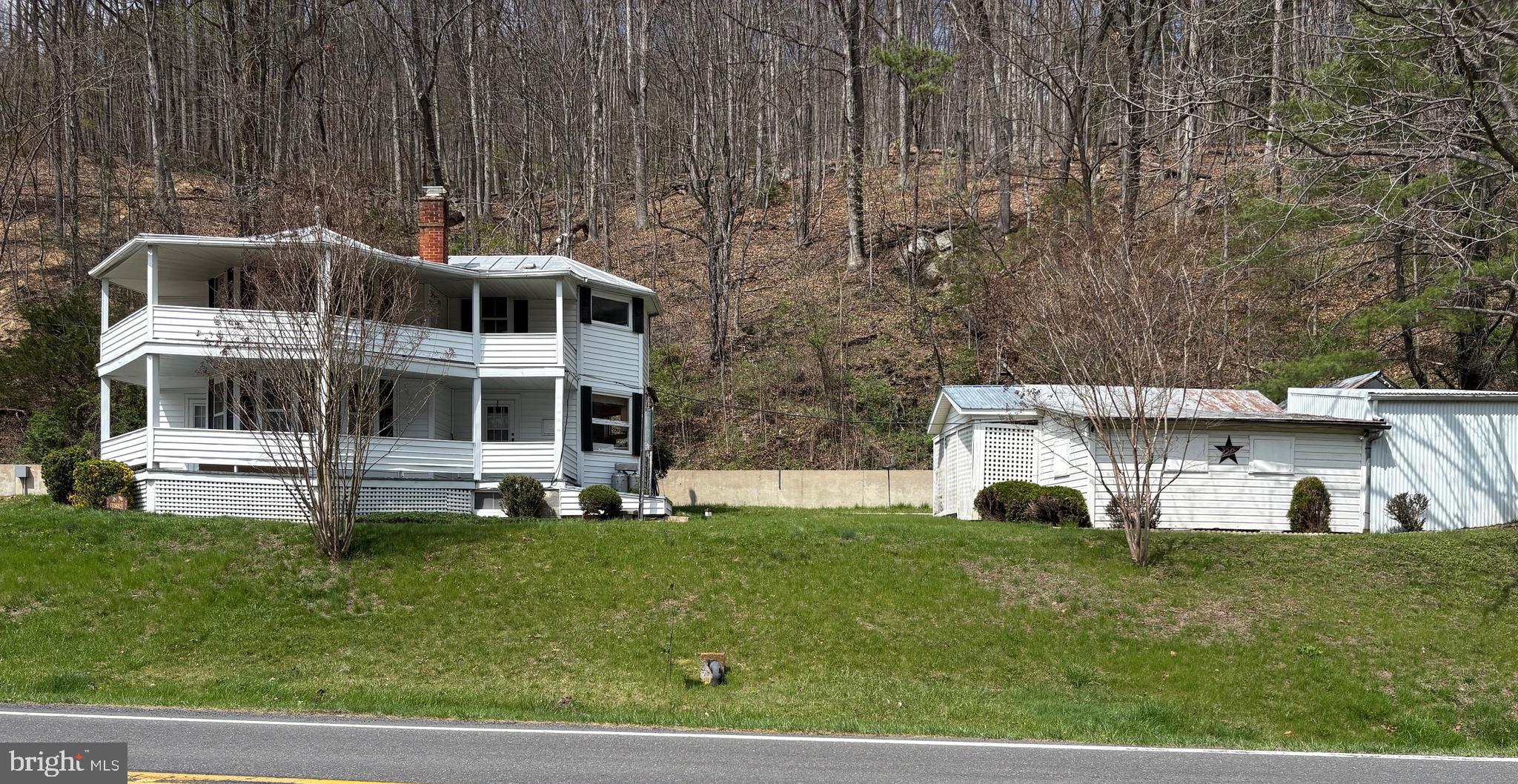 Dreaming of owning a true piece of Hardy County history?  Welcome to this 2 story, 3 bedroom, 2 bath country circular style home located along the South Fork Road in Peru, WV.  This unique home offers everything for someone who loves the outdoors!!  25 acres prime hunting ground with abundant wildlife, 2 acre river lot front--perfect for throwing up a tent, having a campfire, or fishing.  Expansive coverage for outdoor riding, exploring, and making memories.  Ample garden space.  2 beautiful wrap around porches and one screened in back porch.  Oil heat and central air, Culligan water softener, unfinished dry basement, metal roof, new septic system, remodeled bathrooms, built in gun cabinet, lots of closet space, hardwood floors, carpet, linoleum, living room and den on main level.  Several outbuildings, paved driveway.  Walls are primed and ready to be painted color of your choice.  Property is located close to towns and cities--18 miles from Moorefield, WV, 49 miles from Harrisonburg, VA, 25 miles from Franklin WV.  It would be perfect for full time living, weekend getaway or a B&B.  Don't miss out on this special property.