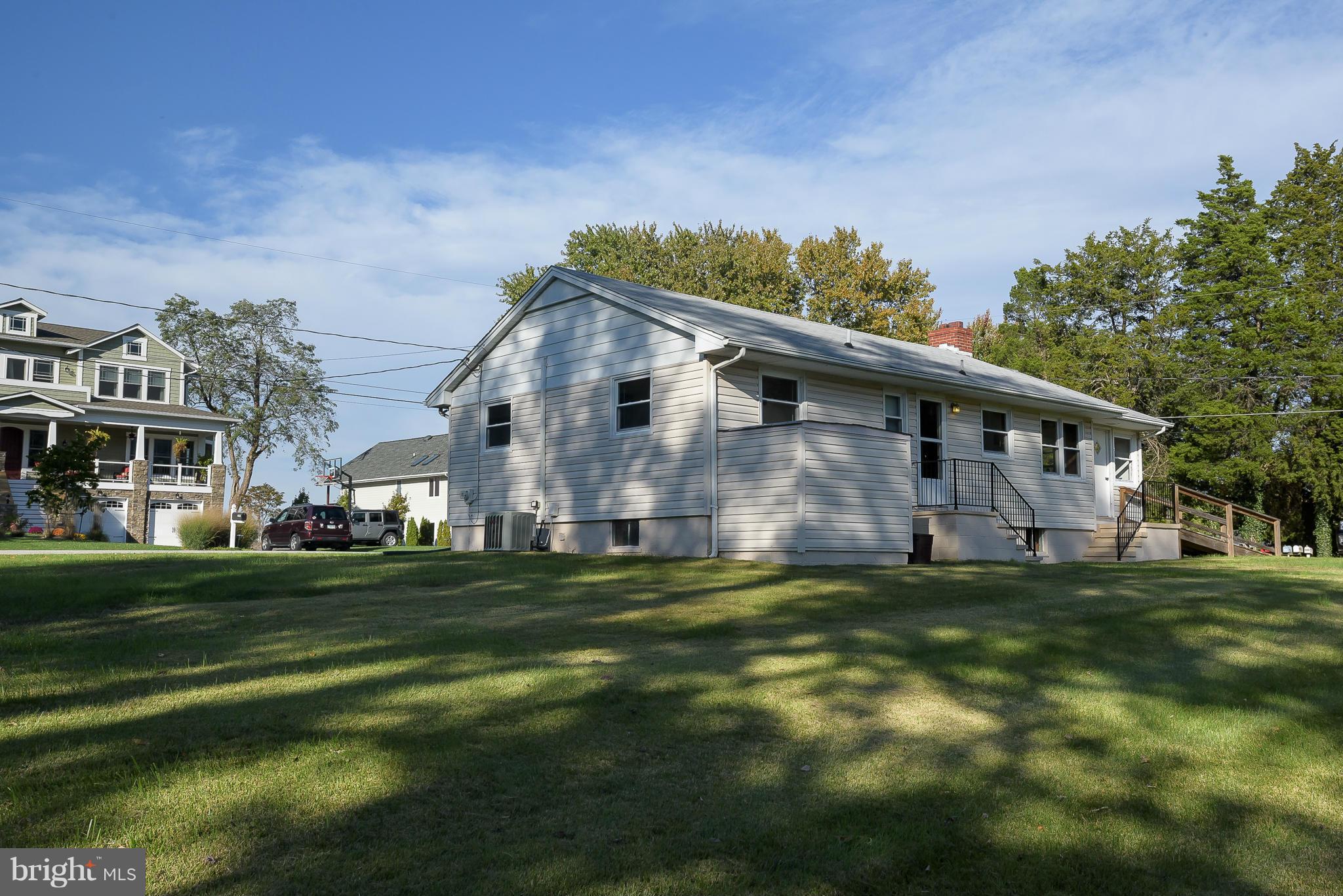 Great Water Views from this spacious rancher with huge yard. 5 Bedroom Home- 3 bedrooms & a full bath on the main level & 2 bedrooms & full bath on lower level. Enjoy the water views from your living room, enclosed porch & bedrooms.  So many possibilities with the yard.  Space for addition, garage, garden, etc. Community beaches & pier. Enjoy all that ISLAND LIVING has to offer. BLUE Ribbon Schools!