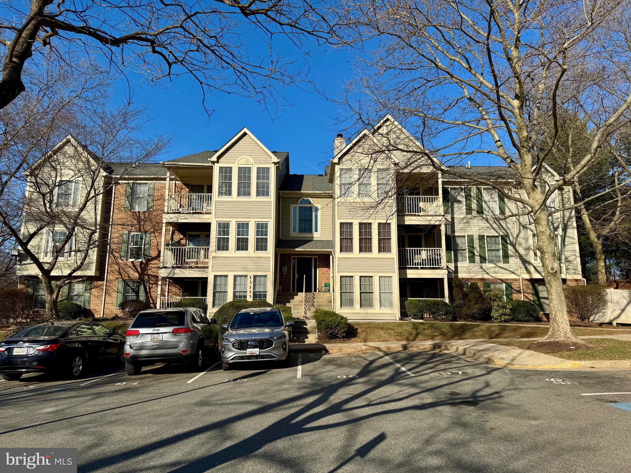 Lovely top-level unit with cathedral ceilings.  Granite countertops in kitchen, Tile backsplash, Ceramic flooring, Smooth top stove, Built-in Microwave.  Dining/Sunroom off kitchen.  Decorative wood moldings.  Natural hickory Hardwood flooring.  Balcony (to be power washed/painted mid April).  Water/sewer included in condo fee.  HVAC & HWH 5 yrs., Washer/Dryer 2 years.  Reserved and unreserved parking.   Not FHA approved.  VA approved.  Near public transportation, Lakes, Shopping, 270, Germantown Town Center, MARC train.