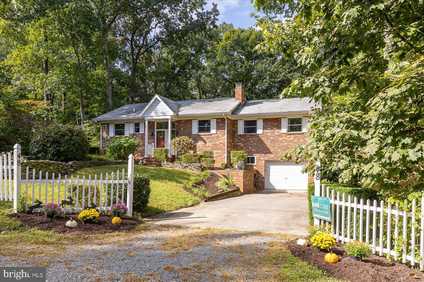 Step into this newly renovated gem nestled in the highly sought-after Blue Ridge Shores community! Located in the heart of Louisa county, this exclusive gated neighborhood boasts a pristine lake, ideal for boating, fishing, and swimming. With an impressive 5 miles of shoreline, a spacious beach, boat launch, play area, volleyball and basketball courts, and a charming picnic spot, there's no shortage of outdoor activities to enjoy.

Indulge in the breathtaking winter water view from the primary suite, just a quick two-minute stroll along the enchanting wooded path maintained by the HOA.

This stunning all-brick, two-level home has been meticulously updated, offering generously sized rooms including 3 bedrooms and 2 full baths. With fresh paint and newer carpeting throughout, the interior exudes a sense of modern elegance. Cozy up by one of the two fireplaces during chilly evenings, or unwind on the expansive patio adorned with a charming pergola. Additional features include two sheds for ample storage, a convenient central vacuum system, and an updated kitchen that will surely impress.

Whether you're seeking a permanent residence or a vacation getaway, this home is ready to welcome its new owner with open arms. Don't miss out on this incredible opportunity!

Updates are as follows - HVAC 2015 converted from oil to Gas, Roof approx. 12 years, Windows 2010, Hot Water Heater August 2023, Kitchen remodeled in 2016 to include refacing of cabinets, marble countertops, new flooring this year, updated appliances,  Washer/Dryer 2016, Water Softener 2016, 

Large shed is 12 x 18 & has window A/C unit,  Second shed is 10 x 12
Two fireplaces - lower level is propane, upper is wood burning
Window air conditioner is supplemental use only.