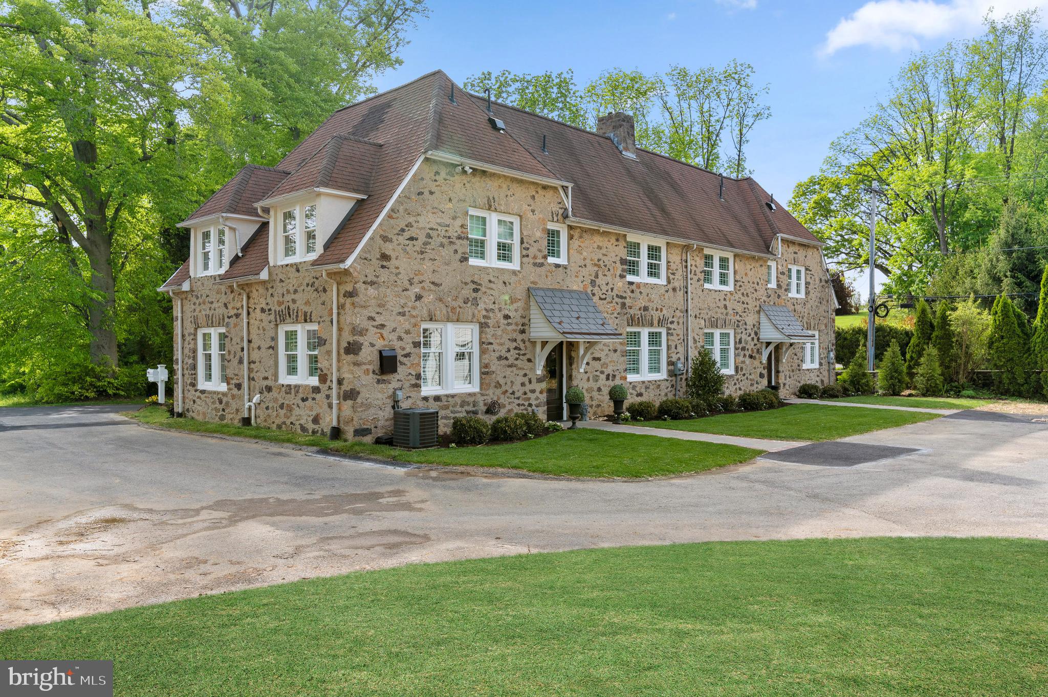 Welcome to 7 Ayrshire Drive, the original, Cotswold style, gatehouse twin home that stands guard at the entrance to Ardrossan Farms, in Villanova, one of the most coveted, private communities on Philadelphia's Main Line. This charming twin unit has been completely renovated and now offers a modern, sophisticated living opportunity with new amenities in a bucolic setting. Situated on a flat, professionally landscaped, .80 acre lot, this home offers 2 Bedrooms, 2 Full baths and a main level powder room. Enter the first floor through either the family entry or the rear courtyard entry door to a stunning, all white, sun-filled kitchen with elegant quartz countertops, built-in Whirlpool appliances and island seating which separates the dining area/family room or home office. Restored, original, hearty pine floors throughout. The first floor also includes a powder room in the family entryway, just outside of the quaint living room which is located in the middle of the home and includes a handsome gas fireplace, custom wood surround and mantle, and large windows overlooking both the eastern (Ivy Lane) and western (Tyler Lane) views of the Ardrossan farm land. Wide, white Plantation shutters cover every window. Back to the family entry, climb the stairs where on the right you find the spacious Master bedroom with a walk in closet, custom built-ins, recessed lighting and a brand new, chic Master bath done in a calming, white & gray, ceramic tiled walk in shower with double sink, Carrara marble vanity countertops. On the left side you pass a spacious hall closet before leading down the hall to bedroom #2 and full bath #2 featuring an all-white tub/shower with modern, hi gloss, beveled subway tiles. Make your way back to the rear entry/kitchen area where you find the door to the basement. Completely waterproofed and spotless. New LG washer/dryer & laundry area. Ample open space ready for becoming an extra playroom, office, or simply a storage room. You will find the details highlight the expert craftsmanship that went in to lovingly restoring this unique piece of history. The entire interior, all windows, wiring, plumbing, heating and A/C have been replaced and updated. 2 heating zones and 1 central A/C zone. In the back yard you will enjoy a partially fenced off flagstone terrace dedicated to your unit and perfect for outdoor entertaining. Home includes two walled off bays in a detached 3 car garage and ample parking spots on the asphalt driveway. Live among some of the most beautiful homes in Radnor, on the magical grounds of a gentleman's farm, that at one time included over 800 rolling acres from Godfrey to Church Roads. What makes this property more incredible is the close proximity to town, schools, shopping, and restaurants. Go for peaceful walks in the expansive, pastoral community or enjoy the setting from your luxurious rear yard. Public sewer and water. Located in the award-winning Radnor School District and minutes to all major roadways for an easy commute to Philadelphia, Wilmington and the airport! Resident pays electric, gas, water and sewer. Landlord pays meticulous landscaping and snow removal as well as HOA fees.
