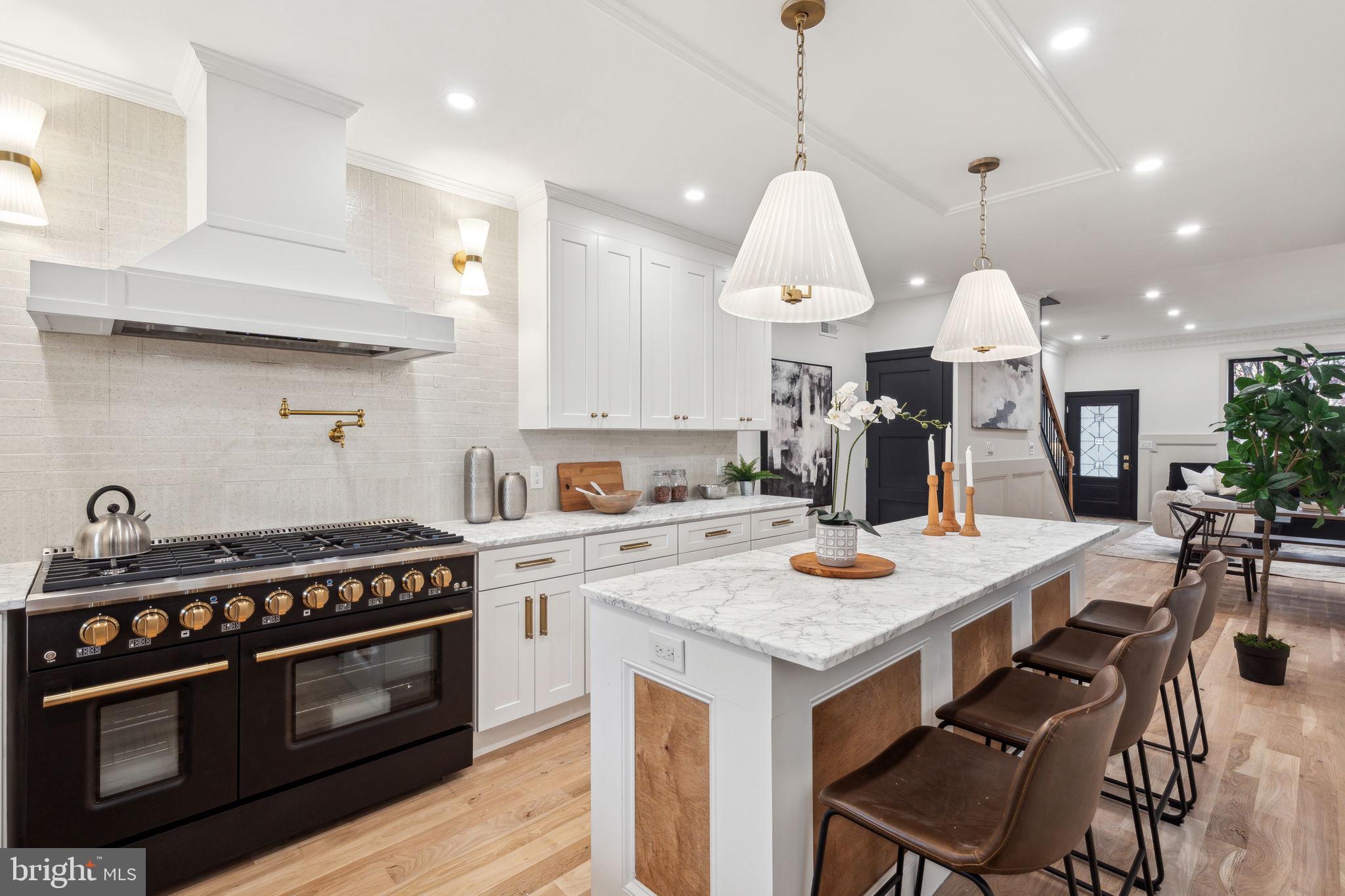 Nestled in the heart of Fishtown, this home is filled with endless hand picked finishes! The open floor plan is over 2,300 square feet and features 4 bedrooms and 3 bathrooms, plus several private outdoor spaces, one of them being a deck off the third floor with skyline views. Walking in you find a light filled open concept with a spacious living & dinning room, culminating in a designer kitchen. Each living level is peppered with millwork and light fixtures that give each room life. The primary suite is highlighted by an oversized bathroom, walk in closet and bedroom with custom trim detailing. Enjoy a short walk to Frankford Avenue's most popular bars, restaurants, and shopping. This charming townhome is bursting with character and influenced by a modern twist to traditional design that focus on simplicity and function. Comes with a 1 year builders warranty.