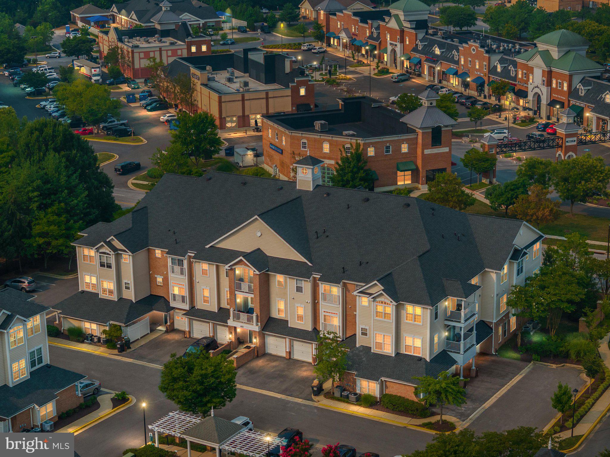 Welcome to easy living in one of Edgewater's most sought-after 55+ communities! Ideally located in the heart of Edgewater, this community offers an exceptional lifestyle with amenities that include multiple swimming pools, tennis and pickleball courts, scenic walking and jogging paths, golf course (memberships available), tot lots and more!  Enjoy the convenience of being able to walk to shopping, restaurants, medical offices, the library, and many other everyday essentials. Located on the third floor, this freshly painted and newly carpeted 2-bedroom, 2-bath condominium is move-in ready. The spacious primary suite features two closets, dual vanities, a relaxing soaking tub, and a separate shower. There is an additional full bath and second bedroom. The inviting living room offers a cozy fireplace, perfect for chilly evenings, and is flanked by two French doors that fill the space with natural light and lead to the balcony.   The kitchen flows seamlessly into the dining area, creating a comfortable space for everyday living and entertaining.  A separate laundry room just off the kitchen provides added convenience.  Included are a deeded garage parking space and a storage cage, offering  additional storage. Whether you're looking to downsize without compromising on comfort or embrace a low-maintenance lifestyle filled with amenities and convenience, this is the place for you!  Welcome to your new home.
