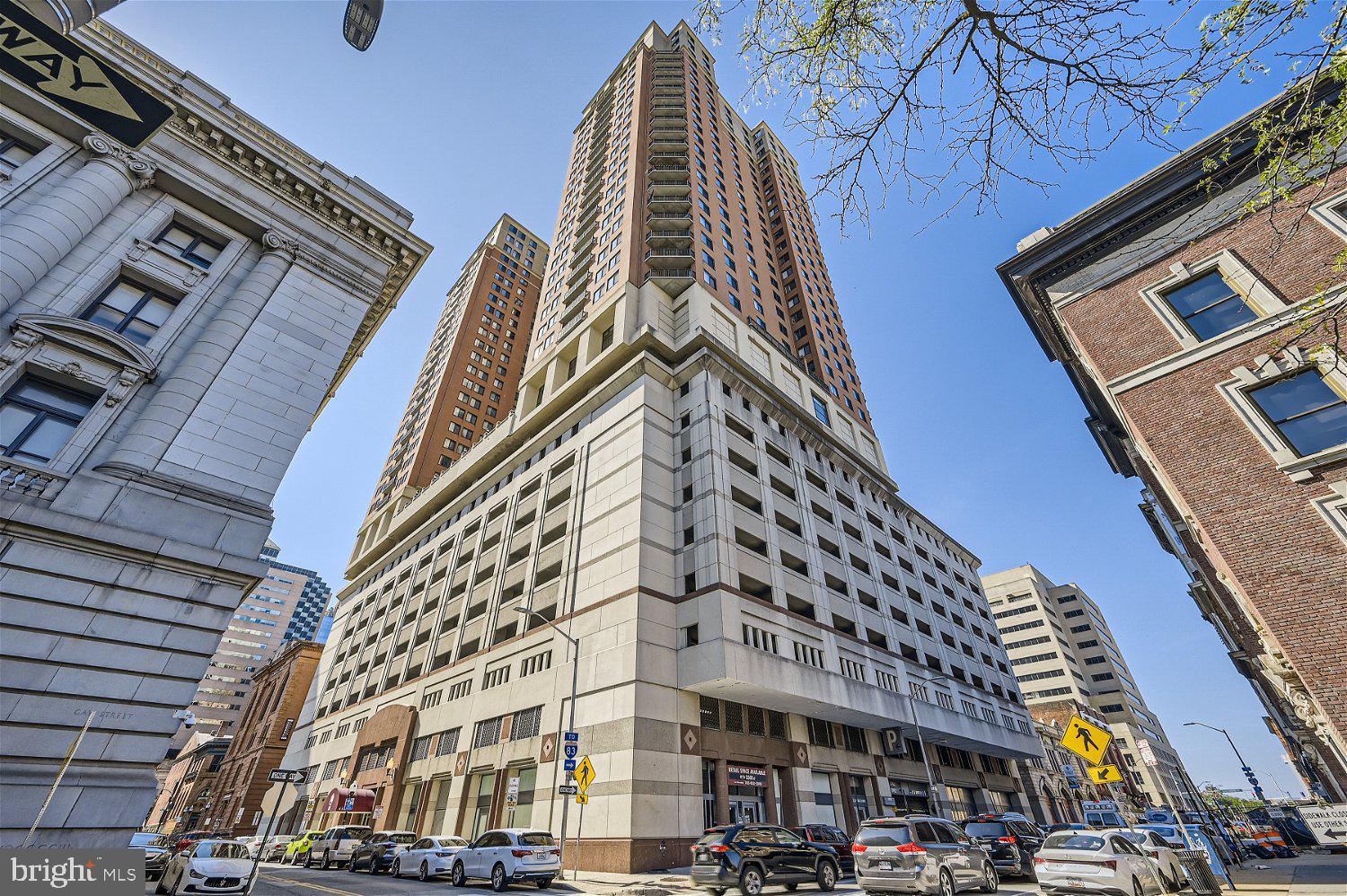 This stunning high floor south facing two bedroom two bath condominium offers an open floor plan filled with natural light and sweeping views of the Inner Harbor! Interior features include many upgrades including  hardwood floors throughout, upgraded kitchen with granite countertops and custom tiled bathrooms. The flexible living/dining room is perfect for daily living and entertaining with easy access to the private balcony with amazing views. Two spacious bedrooms including a primary bedroom suite with walk-in closet and private full bath with a custom tiled walk in shower and granite vanity.  414 Water Street offers residents full service amenities including 24-hour front desk staff, lobby security, outdoor swimming pool, event room, fitness center and business center. This residence comes with a highly sought-after storage room on the same-floor and an assigned parking space.  Live a turnkey lifestyle in the heart of downtown just steps to great dining, shopping, entertainment and minutes to I-83 and I-95.