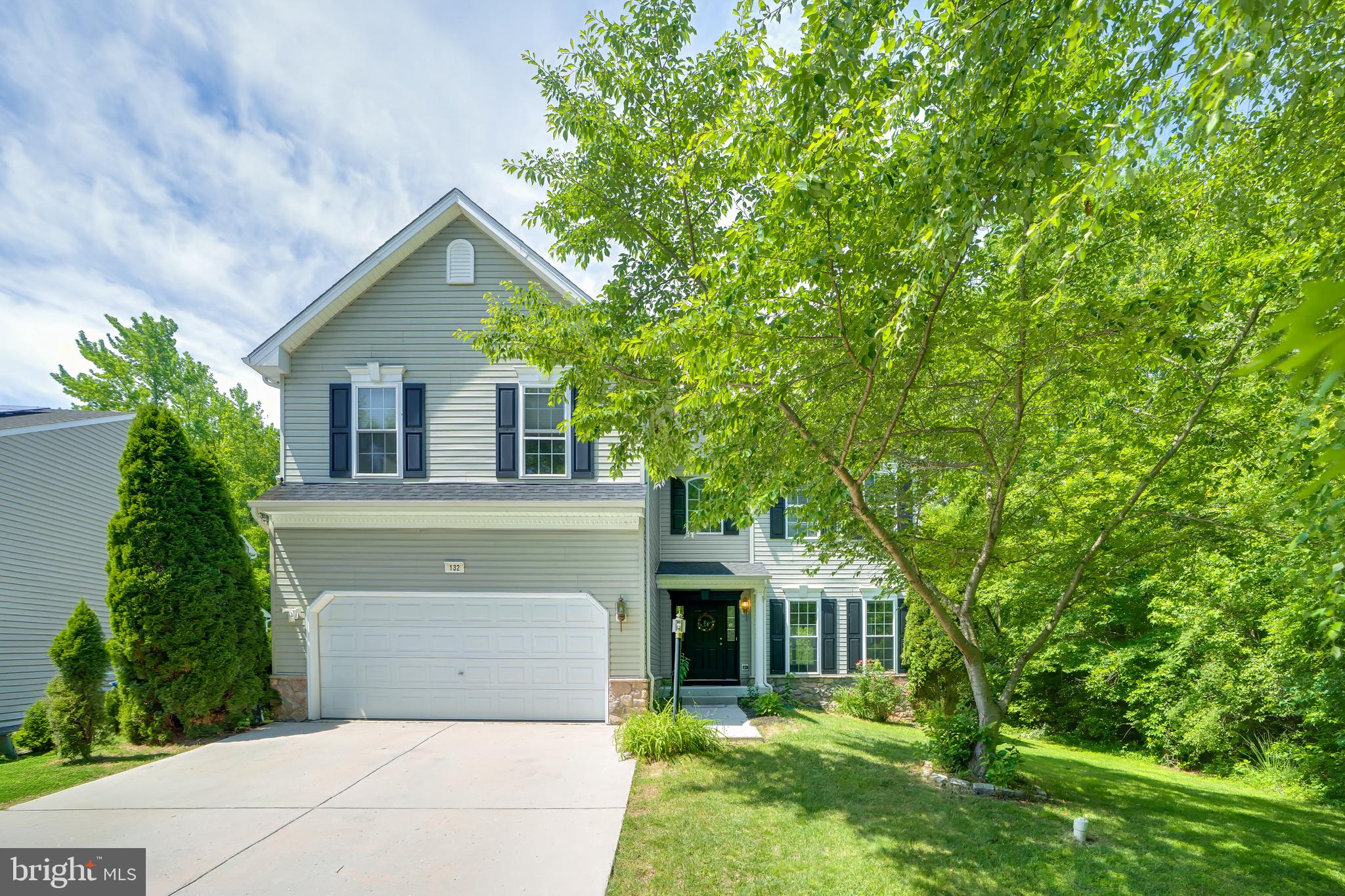 There's no place like home in Patriots Glen! Summer is here, making it the perfect time to enjoy the community pool, kiddie pool, playground, and tennis courts. Patriots Glen Golf Club, the Launch Zone driving range, and The Tavern at Patriots Glen are also conveniently located within the neighborhood. This 4-bedroom, 2.5-bath home welcomes you with a covered front porch, soaring two-story foyer, and impressive two-story family room with a gas fireplace. The eat-in kitchen features an island, stainless steel appliances, pantry, and access to the rear deck overlooking the fenced backyard with wooded views and seasonal views of the golf course and pond. Formal living and dining rooms provide additional space for entertaining, while a main-level laundry room, half bathroom, and access to the attached 2-car garage complete the first floor. Upstairs, the spacious primary suite offers a vaulted ceiling, room for a sitting area, walk-in closet, and private bath with dual vanity, soaking tub and walk-in shower. Three additional generously sized bedrooms share a full hall bathroom with tub shower. The unfinished basement provides abundant storage and features an exterior access door with stairs to the side yard. Recent updates include a new roof in 2021, recently replaced water heater, and a leased solar energy system installed in 2015. Seller reports reduced electric costs, with the solar lease to be assumed by the buyer subject to solar company approval. Conveniently located near the MD/DE state line and major commuter routes, this home offers spacious living, desirable community amenities, and a scenic golf course setting. Schedule your tour today!