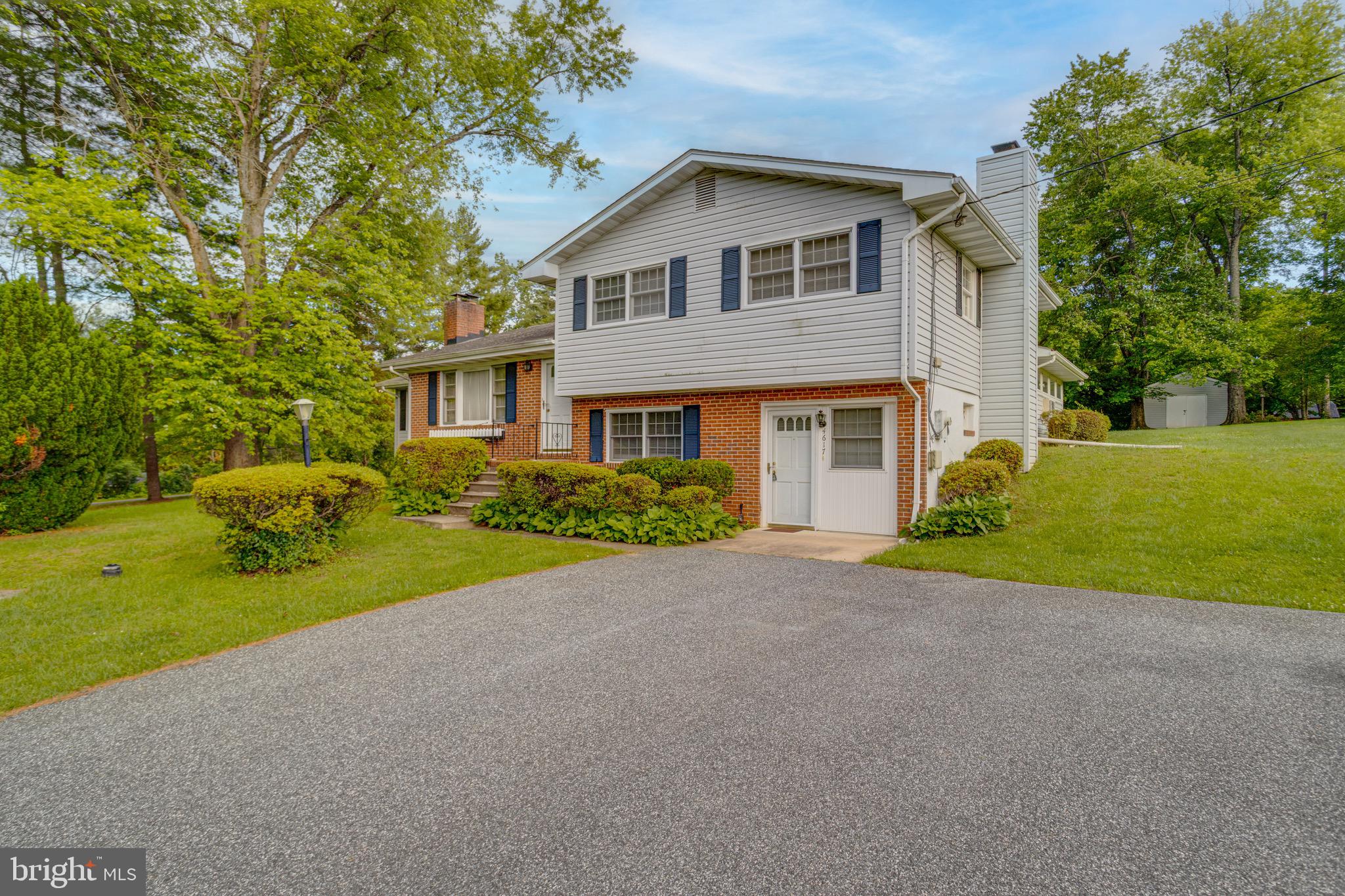 Welcome to this 3 bedroom, 2.5 bath home set on just over an acre in the highly coveted area of Glen Arm.  Pull into the driveway and park on the small parking pad.  Entering through the bottom front door leads you into a finished basement area complete with a built in bar and a wood stove.  There is a full bathroom with a walk in shower off of this area.  Headed straight back a short flight of stairs takes you to a large carpeted sun room area, with ceiling fans and a wood stove.  This area is surrounded by windows giving you a panoramic view of the rear yard.  Back in the basement there is also an unfinished storage room with work benches and access to mechanicals.  To the left of the basemen area a short staircase leads you to the main floor of the home.  Here you'll find a living room with a wood burning fireplace, and the front door of the home.  The living room leads into the large kitchen, which has tile flooring, plenty of cabinet and counter space, and all stainless steel appliances.  There is room for casual dining in this kitchen, and a door off of the casual dining area leads out onto the wooden rear deck.  The kitchen also flows directly into a large formal dining room with chandelier.  Back in the main living room area a short staircase leads you to the upper level.  Up here you'll find three bedrooms, one of which is the primary suite with its own powder room and private access to the full bath.  The full bath has hallway access as well and comes with a tub/shower combo.  It's hard to find anything in this price range in this area.  House is being sold strictly As-Is.  Bring your creativity to this one and it could be a beauty!