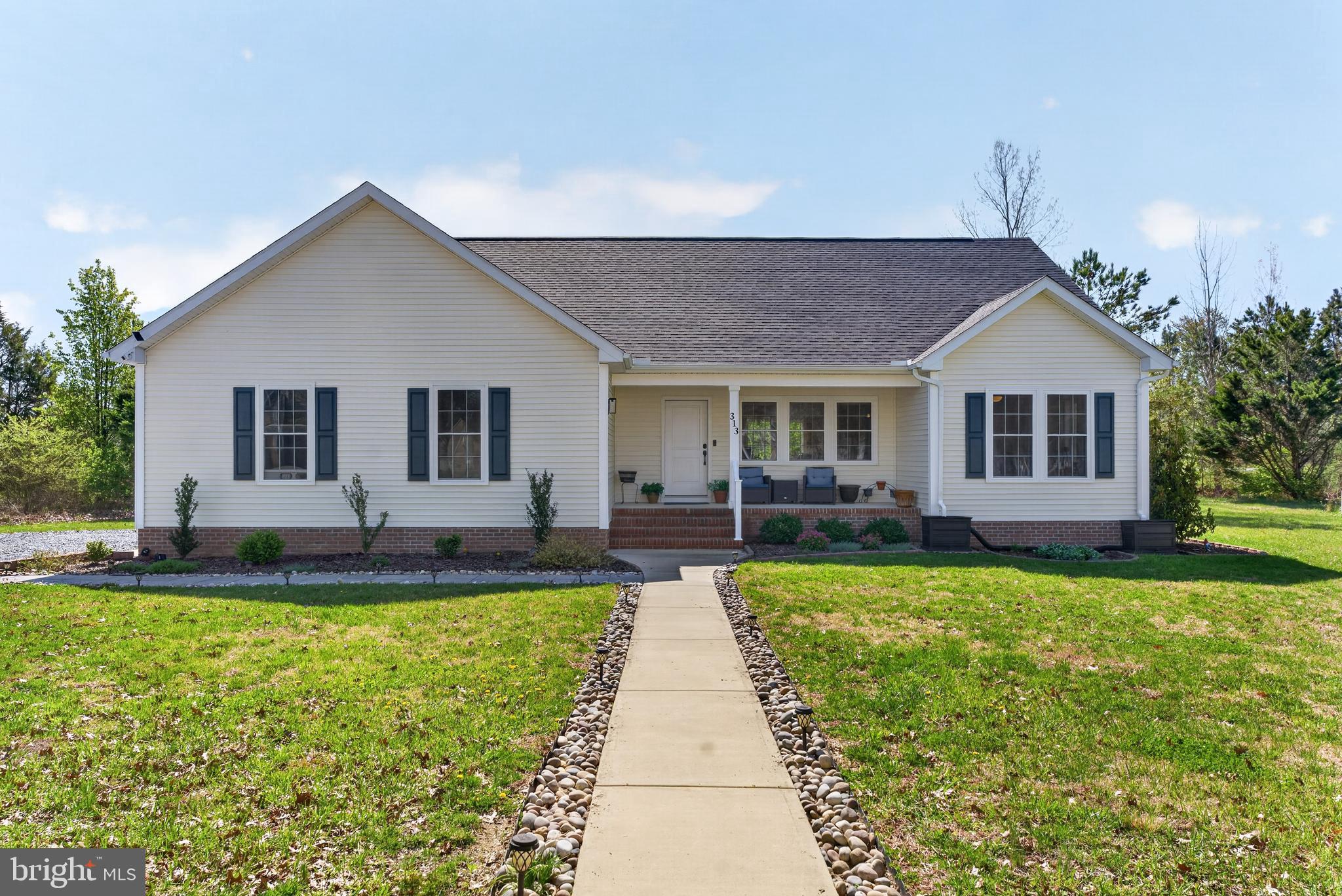 Welcome to 313 Edmonson Ln in East New Market—a beautifully built 3-bedroom, 2-bath home completed in 2022 by respected local builder Koski Homes. Designed with comfort and functionality in mind, this home features a bright, open floor plan filled with natural light, luxury vinyl plank flooring throughout, and a seamless flow between the living, dining, and kitchen areas. The kitchen is equipped with granite countertops, ample cabinetry, and modern finishes, making it perfect for both everyday living and entertaining.

One of the standout features of this home is the solar panel system, which will be fully paid off and conveys to the new owner—providing significant energy savings with an electric bill that is largely covered. This is a rare opportunity to enjoy long-term efficiency and lower utility costs from day one.

The spacious primary suite offers a relaxing retreat with plenty of room to unwind, while wide doorways throughout the home provide wheelchair accessibility and ease of movement. Additional features include a conditioned crawlspace as well as a 2-car garage.

Located just about 2 miles from the river and only 5 minutes to a nearby boat ramp, this property is ideal for those who enjoy outdoor living and water access. A nearly new home with modern upgrades, thoughtful design, and unbeatable energy efficiency—this one checks all the boxes.