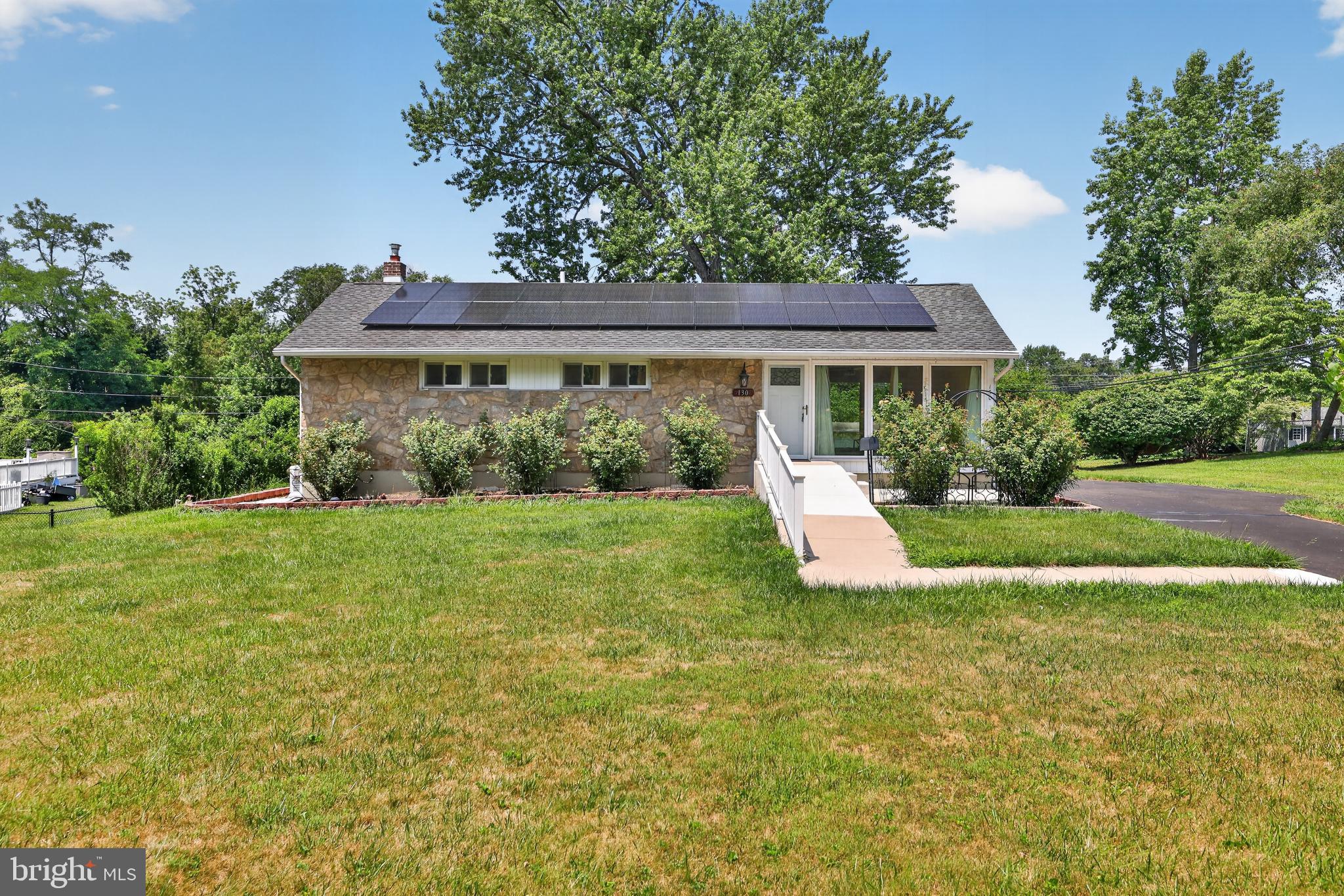 Welcome to 130 Acorn Dr!  Experience the perfect blend of energy independence, modern comfort, and everyday convenience in this thoughtfully updated home. The property includes owned solar panels that transfer with the sale, an Enphase battery storage system, and a whole-house backup generator, providing exceptional energy efficiency and reliable power during extended outages. The current owners typically enjoy energy bills of less than $15 per month, with recent bills as low as $0, depending on usage and seasonal conditions.

The bright, updated kitchen is the heart of the home, featuring a spacious center island, abundant cabinet storage, and premium soft-close Diamond cabinetry. A generous lower-level pantry with a full-size refrigerator provides exceptional storage and added convenience for everyday living.

The home offers two full bathrooms, including a spacious primary suite with a large walk-in shower, built-in bench and heated floors, as well as a second full bathroom featuring a walk-in tub. Triple-pane windows throughout the living and dining areas fill the home with natural light while enhancing comfort, quietness, and energy efficiency year-round.

Recent improvements include a new 75-gallon energy-efficient water heater (2026), a new central air conditioning system (2021), and new carpeting in the finished portion of the lower-level basement, creating a versatile space ideal for a family room, recreation area, home office, or fitness space.

Step outside to enjoy a private, spacious backyard with two large storage sheds, offering ample room for tools, equipment, and hobbies.  Ramp access provides easy entry, and the expansive driveway accommodates two vehicles with additional parking for up to four more.

With its outstanding energy-saving features, quality updates, accessible design, generous storage, and move-in-ready condition, this home offers an exceptional opportunity to enjoy comfort, efficiency, and long-term value.