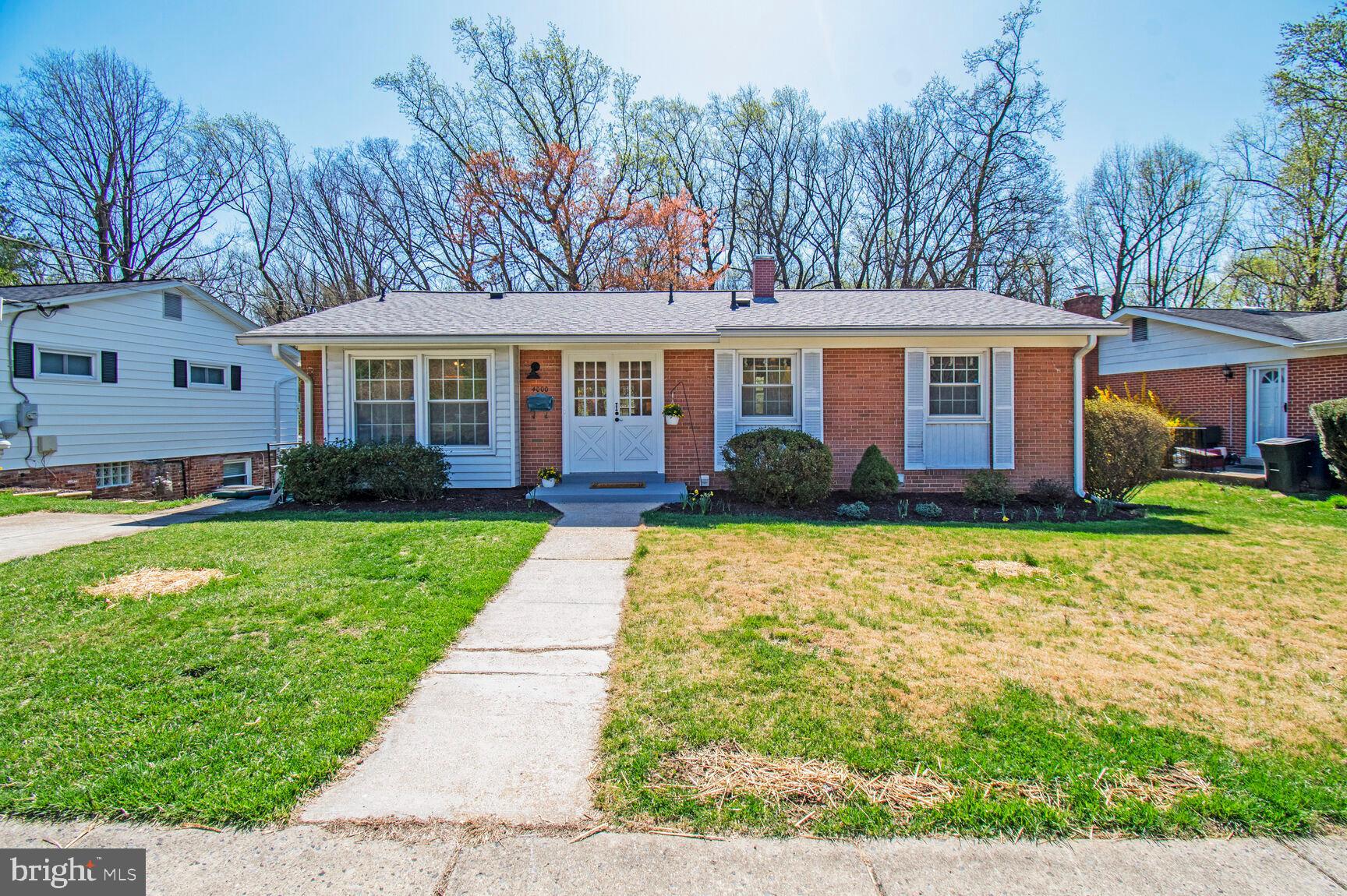 This well-built mid-century rambler with a brand-new warrantied roof and updated windows is sure to check many boxes. Tucked into the Garrett Forest neighborhood on a dead-end street (with walk-through gate) with blossoming woodlands in back and a senior care center set high on a hill in front, this location is both private and quiet. Glorious living room picture window brings in the outside woods! Table-space kitchen with new flooring, quartz countertops, and appliances plus a convenient side entrance. Partially finished basement with huge family room, gas fireplace and window-filled walk-out to patio and flat backyard. French drain & sump pump recently installed and warrantied. Bonus room (BR4) with full bath, large laundry/utility room and extra storage space to boot! Convenient to multiple metro stops, bike trails, and mere minutes to retail + bus and commuter routes.
