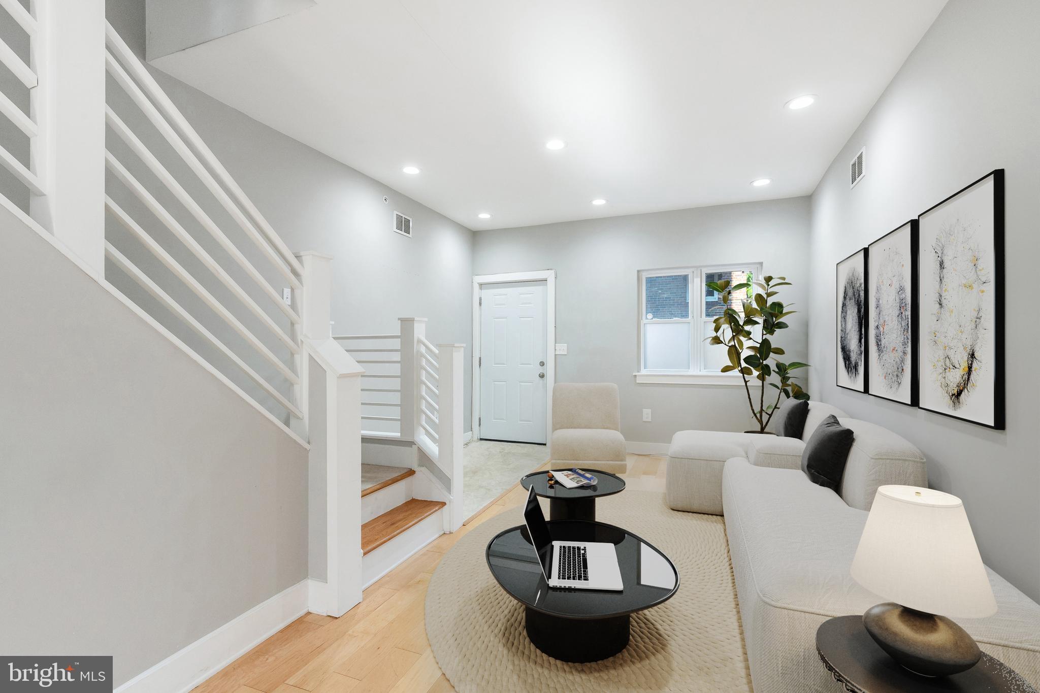 Welcome to 1446 S Mole St, a quiet street nestled in the vibrant and dynamic Newbold neighborhood, mere footsteps away from the bustling South Broad Street, and subway system that easily connects you to Center City. Located close by to a plethora of charming cafes including Hive Cafe & Batter and Crumbs, restaurants, and convenient shopping at Target and Sprouts on Washington Ave. This home has a remaining tax abatement until 2027, that will keep your taxes low! The interior offers an open floor plan on the 1st floor with the spacious living room, dining, powder room and large kitchen. The gourmet kitchen stands as a culinary haven boasting white shaker cabinets, with pantry, and luxurious granite countertops that gracefully extend into a peninsula, perfect for entertaining guests. Venture upstairs to discover the second floor, where two generously sized bedrooms beckon you with their allure, each adorned with ceiling fans to ensure your utmost comfort. A large convenient laundry room and a linen closet cater to your daily needs, while a full shared bath epitomizes elegance and relaxation. The third floor is a dedicated oasis, a palatial primary suite that will whisk you away to a world of tranquility. Relish in the luxury of a walk-in closet offering ample space for your wardrobe. The grand en-suite bath redefines indulgence, with its floating double sink vanity, designed to elevate your daily rituals. A charming rear balcony  awaits your moments of reflection and views of the city. There is also a generous rear yard that conveniently connects to the front via an easement for accessing your trash cans to and from the street.