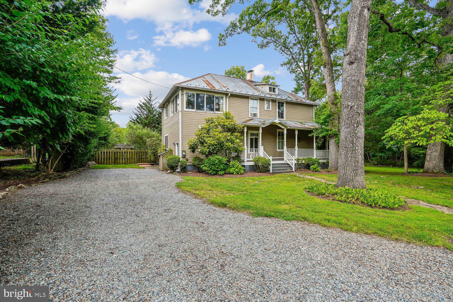 Nestled in the charming community of Washington Grove, this exquisite Victorian home, built in 1902, seamlessly blends historic elegance with modern comforts. Spanning 2,112 square feet, this detached residence boasts four spacious bedrooms and two and a half bathrooms, making it an ideal sanctuary for those seeking both space and style. Step inside to discover a thoughtfully designed traditional floor plan that invites natural light to dance across the rich wood siding and double-pane windows. The heart of the home features a delightful breakfast area and a kitchen with ample table space, perfect for casual dining or entertaining guests. Equipped with high-end appliances, including a double wall oven, cooktop, and dishwasher, this kitchen is a culinary enthusiast's dream. Recessed lighting enhances the ambiance, creating a warm and inviting atmosphere. The living area is anchored by a cozy fireplace, offering a perfect spot to unwind during cooler evenings. The home also includes a dedicated laundry area in the basement, complete with washer and dryer, ensuring convenience in daily living. Venture outside to find a wrap-around deck that beckons for summer gatherings. The property is set on a generous 0.26-acre lot, featuring a gravel driveway with ample parking for guests, accommodating up to six vehicles. Washington Grove is not just a place to live; it's a vibrant community that offers a unique blend of tranquility and accessibility. Residents enjoy the benefits of private lake with small beach and swimming, nearby parks, perfect for leisurely strolls or picnics, and a strong sense of community with various local events throughout the year. The neighborhood is known for its picturesque streets and friendly atmosphere, making it a wonderful place to call home. Additionally, the community is well-served by public services, enhancing the overall quality of life for its residents. This property is a rare gem, combining historic charm with modern amenities in a community that values connection and nature. Experience the best of both worlds in this enchanting Washington Grove residence.