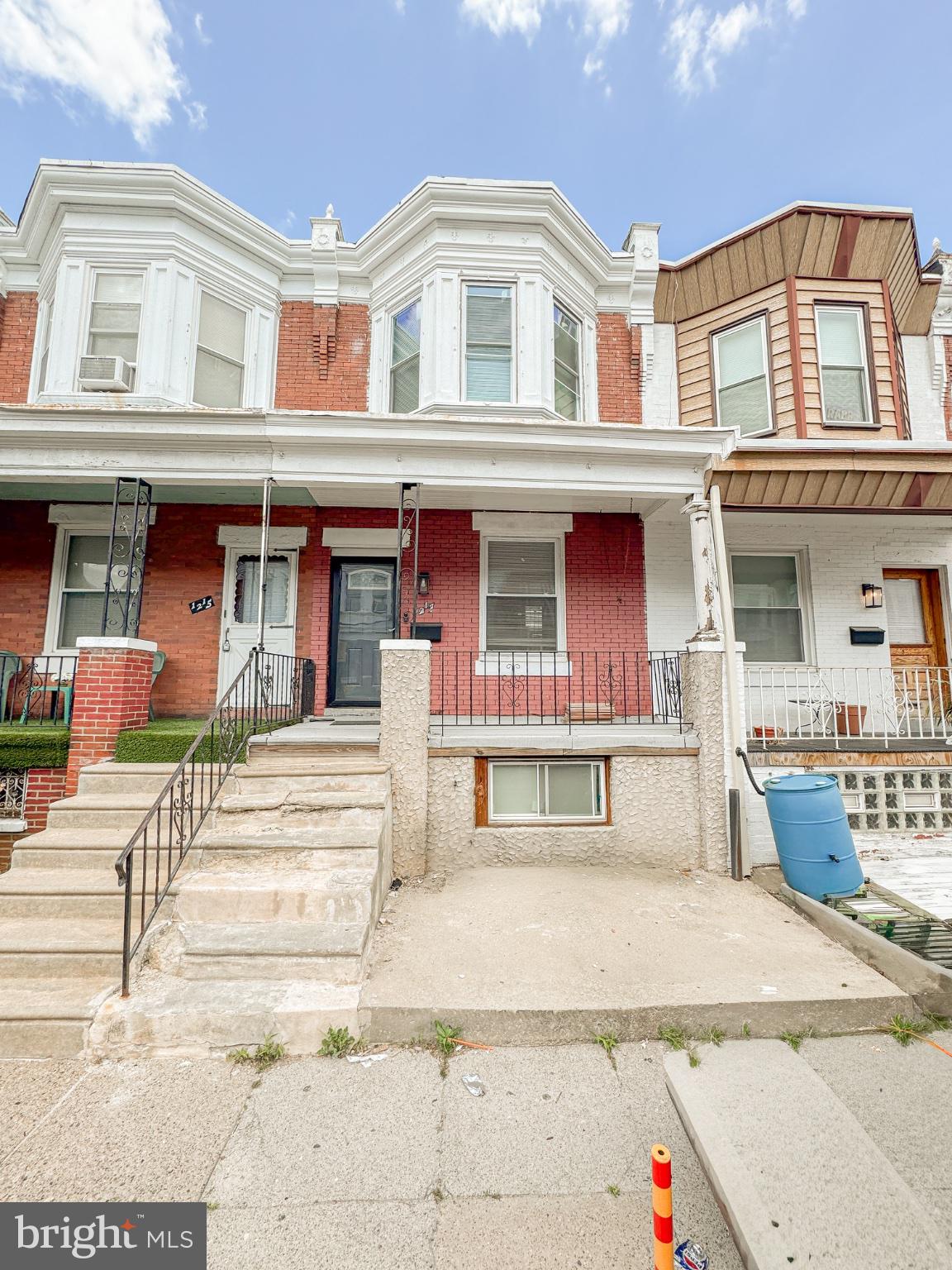 Beautifully updated Philadelphia rowhome featuring a modern kitchen with granite countertops, gray cabinetry, stainless steel appliances, and stylish tile backsplash. Renovated bathroom with walk-in shower, updated finishes throughout, and classic brick exterior with covered front porch. Conveniently located near shopping, public transportation, schools, and major roadways. Move-in ready and perfect for homeowners or investors alike. Schedule your showing today!