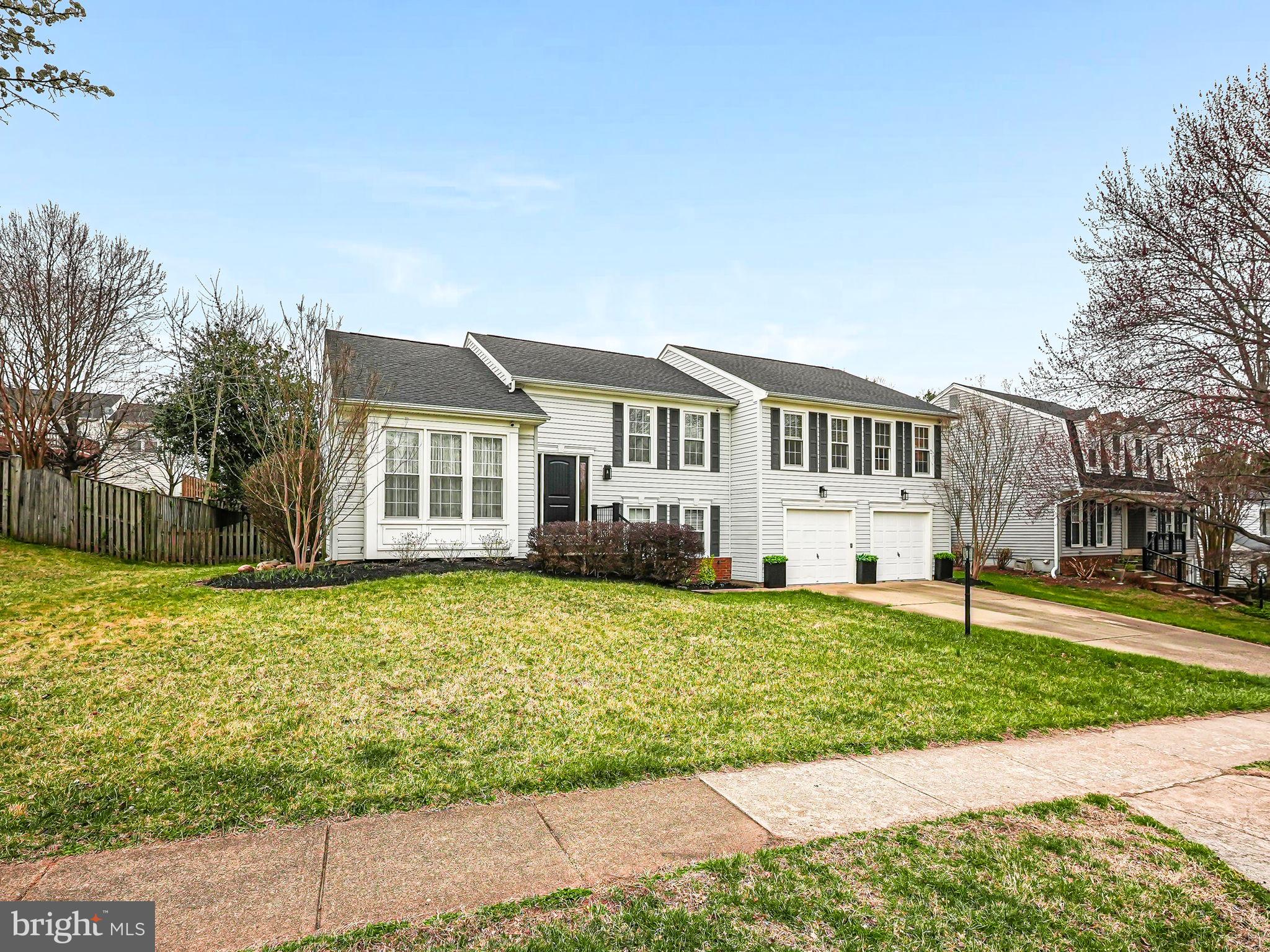 Open House Canceled! Thank you to everyone who came through those first 2 busy days on market!! Welcome to this beautifully designed and remodeled split-level home in the sought-after Environs community! Elegance greets you as you enter the formal sitting room, featuring wood floors and a vaulted ceiling. A few steps up to the main floor, and you'll be amazed by the fully remodeled kitchen, completed in 2020. The marbled granite countertops flow seamlessly into a striking waterfall peninsula, complemented by custom wall treatments, carefully selected lighting, new cabinetry (including upper lighted display cabinets), and under-cabinet lighting. In the kitchen you will also find new stainless steel appliances, a coffee bar, a custom-built wall pantry, and additional lighted display shelves in the breakfast area. Every detail, from the paint to the lighting, was thoughtfully chosen in this kitchen renovation. Adjacent to the kitchen is the formal dining room, featuring chair rails and updated lighting, perfect for hosting formal meals. The primary bedroom suite is spacious enough for a king-sized bed and a sitting area, and includes a dressing area with dual closets. The updated en-suite bath offers a relaxing soaker tub, walk-in shower, and dual vanity. A small bedroom, previously used as a nursery, is accessible through a door in the primary en-suite bathroom as well as the hall. This room can easily be converted into a dressing room!  Two additional well-appointed bedrooms are also on this level, along with a full hall bathroom, which has been updated with granite countertops, an upgraded shower system, and a custom pocket door. The upper level is further enhanced by recessed lighting and custom baseboards, adding to the home's elegant design. The lower level features a large family room with a brick-surrounded wood-burning fireplace, along with two additional spacious, well-lit bedrooms. A full bathroom with a walk-in shower, a large laundry room (which can double as a mudroom or extra storage space). A huge screened porch with skylights is just off the kitchen and is adjoined by an expansive, tiered deck with built in benches and trellis. The main level deck/screened porch cover the large rear lower patio and lead to the above-ground pool, providing ample space for outdoor entertaining. This home is ready for warmer weather! Recent upgrades include: Complete Kitchen Remodel (2022), Roof/Shutters (2024), Water Heater (2022), HVAC with Humidifier (2019)