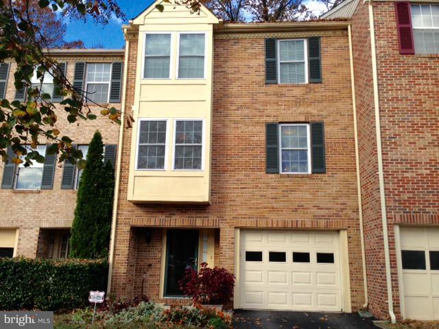 MUST SEE TOWNHOUSE!! Large quality built luxury townhouse with two huge master bedrooms with full baths. All rooms, interior steps and railings are made of beautiful hardwood except bedrooms and bathrooms. Finished family room w/brick fireplace and beautiful hardwood covered ceiling. Formal living room w/brick fireplace. Large eat-in kitchen. Beautiful spiral stairs leading to rear exterior deck.