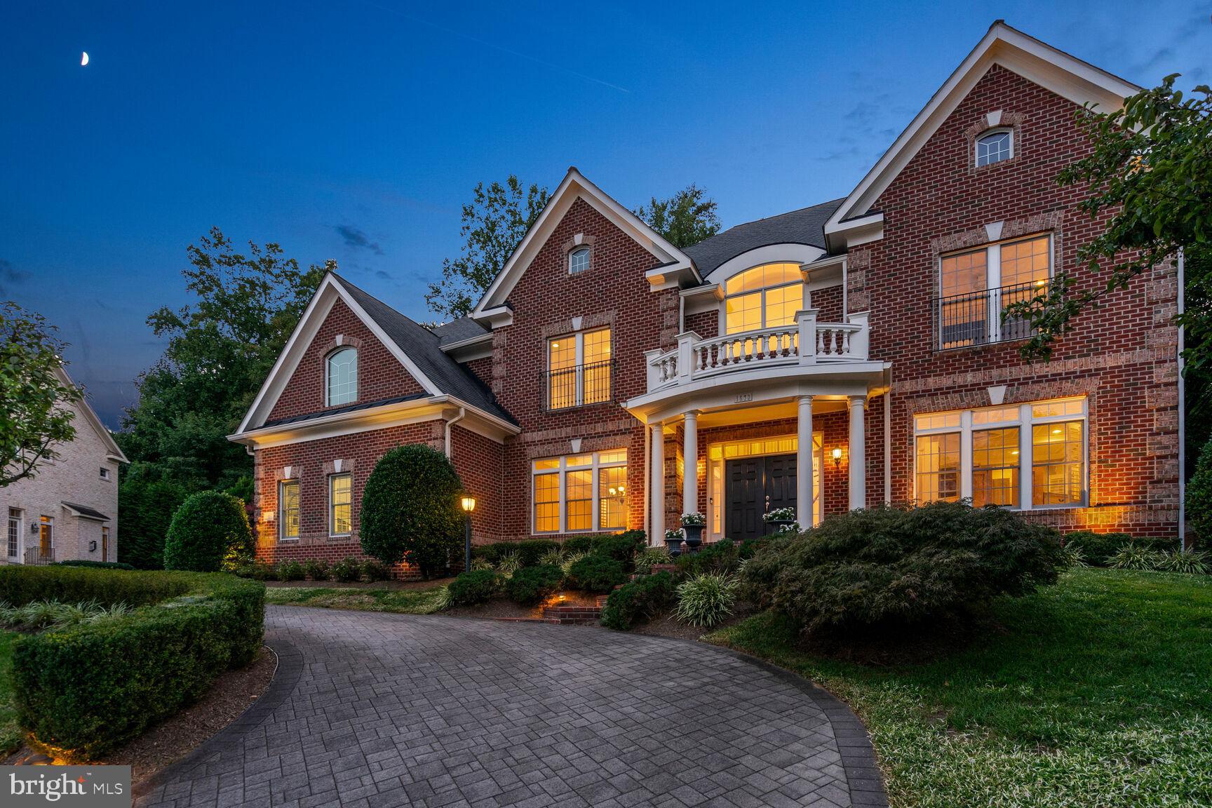 Welcome to 1573 Maddux Lane, an exquisite residence nestled in the prestigious Chalice Crest enclave of McLean. This remarkable home boasts an impressive  7966 square feet of refined living space on a generous 15,597 square foot lot and offers an unparalleled blend of elegance and modern comfort.

As you step into the grand marble foyer, you're greeted by a sweeping curved staircase, setting the tone for the sophisticated design. The main level features an array of thoughtfully designed spaces, including a formal dining room perfect for hosting lavish gatherings and a formal living room ideal for intimate conversations. The open chef's kitchen is a culinary masterpiece with a grand center island, a breakfast area, and a door leading to an outdoor terrace. Adjacent to the kitchen, a spacious family room with a grand stone fireplace enhances the sense of warmth and hospitality.

The upper level is home to an expansive primary suite that serves as a true sanctuary. It boasts a grand stone fireplace, separate walk-in dressing rooms, an ensuite bath with individual vanities, heated floors, a separate jetted tub, and a shower. Four additional bedrooms, three well-appointed baths, and an expansive laundry room with two washers and two dryers complete this level, providing ample space for relaxation and privacy.

The lower level is an entertainment haven. It features a sumptuous movie theater with audio and video necessities, a recreation room with another inviting gas-stone fireplace, and a private in-law room with an ensuite bath. This level offers endless possibilities for leisure and guest accommodations.

Additional highlights include over 9-foot ceilings, a well-appointed office, a powder room, a mudroom with a half bath, a whole-house generator, a built-in grill with ice and condiment storage, and a three-car garage with a state-of-the-art Garage Tek system. Please note that all hardscaping is custom pavers front and back. And if that isn't enough, excellent landscape lighting highlights the residence!

1573 Maddux Lane is more than just a home; it's a lifestyle of unparalleled elegance and convenience. Experience the perfect blend of sophistication and modern amenities in this exceptional McLean residence.